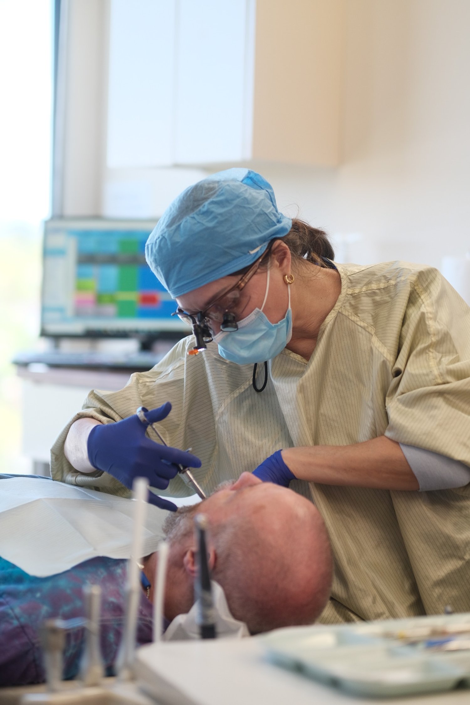 Dentist performing a dental procedure on a patient