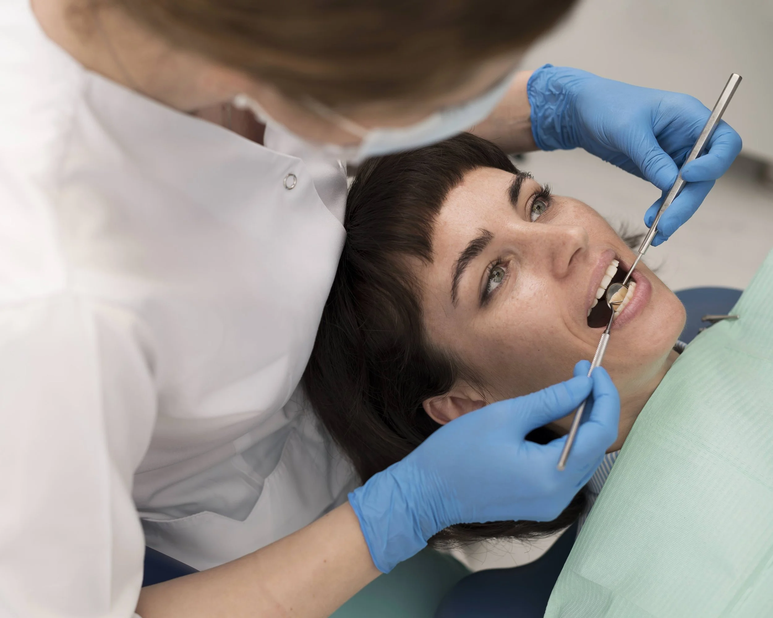 young-female-patient-having-dental-procedure-orthodontist.jpg