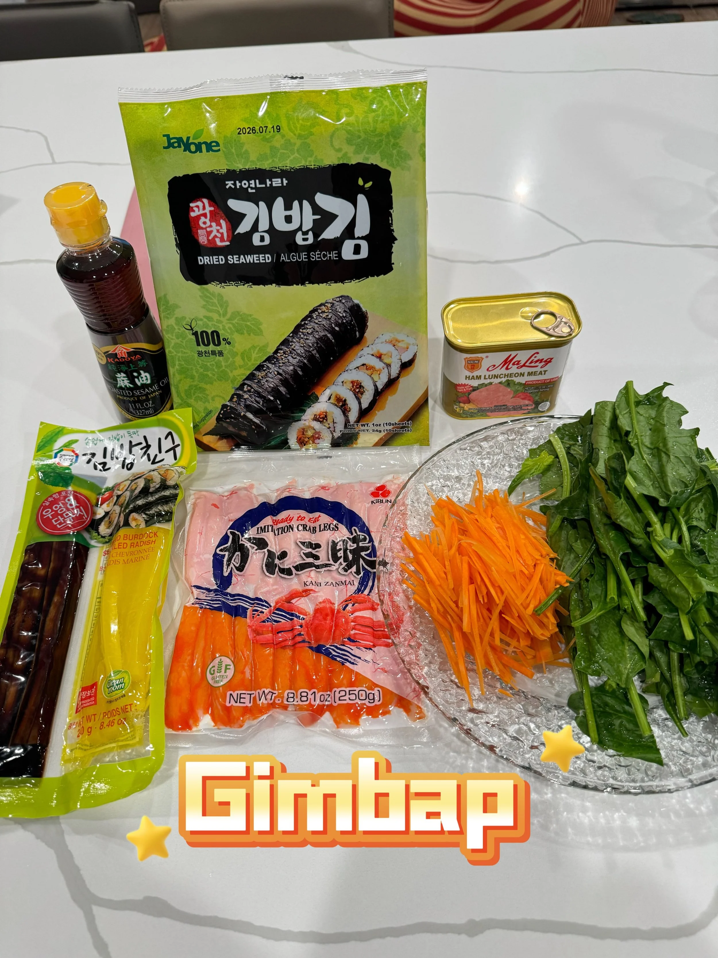 Gimbap / Korean Seaweed Rice Rolls

Ingredients:
Seaweed sheets (nori)
Cooked rice
Carrots
Spinach
Pickled yellow radish
Ham or imitation crab sticks
Sesame oil
Salt

Instructions
Step 1:
Cooking the carrots in the pan. Blanch the spinach and squeeze