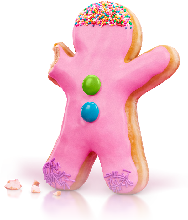 A gingerbread cookie decorated as a pink gingerbread man with sprinkles on top, two colorful candies on the body, and purple sprinkles on the feet.