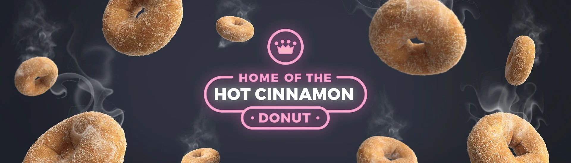 Falling cinnamon sugar donuts with steam rising against a dark background; text overlay reads 'Home of the Hot Cinnamon Donut' with a crown icon above.