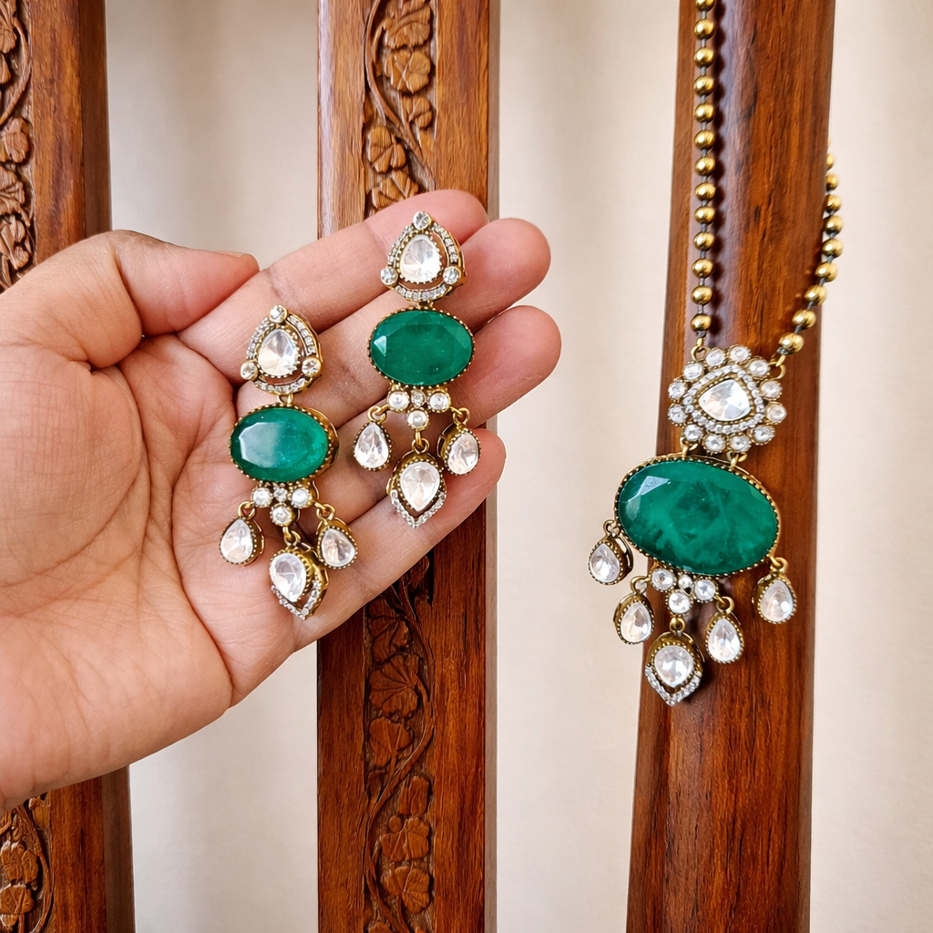 Emerald Pendant Necklace Set Wood Chair.png