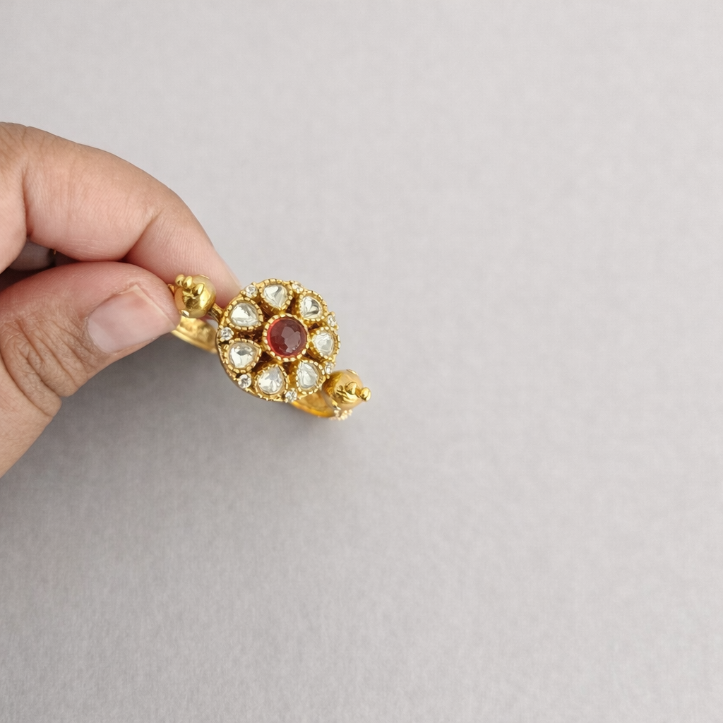 Double Peacock Statement Ring Red Neutral Background Fingers.png