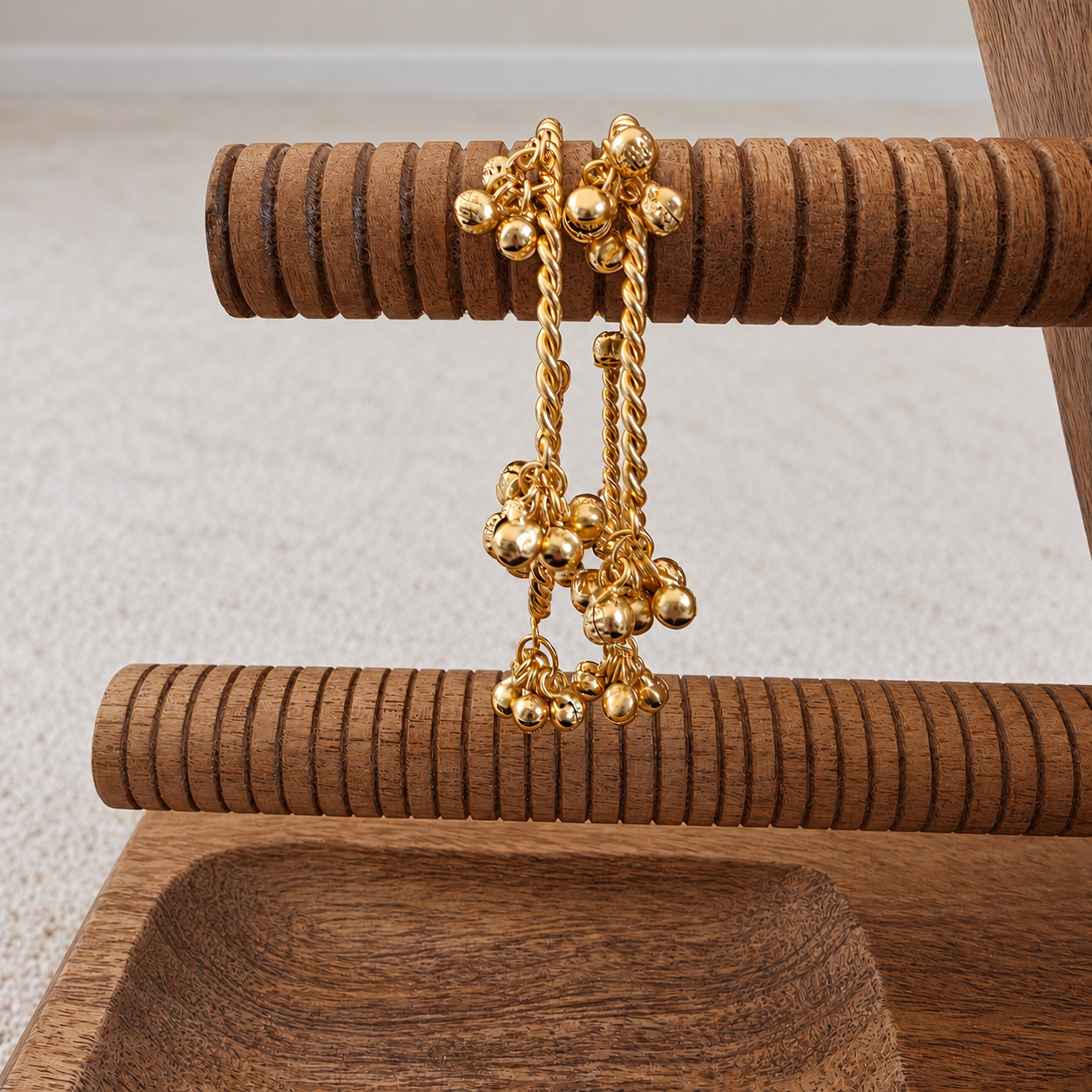 Gold Beaded Bracelet on Wooden Stand.png