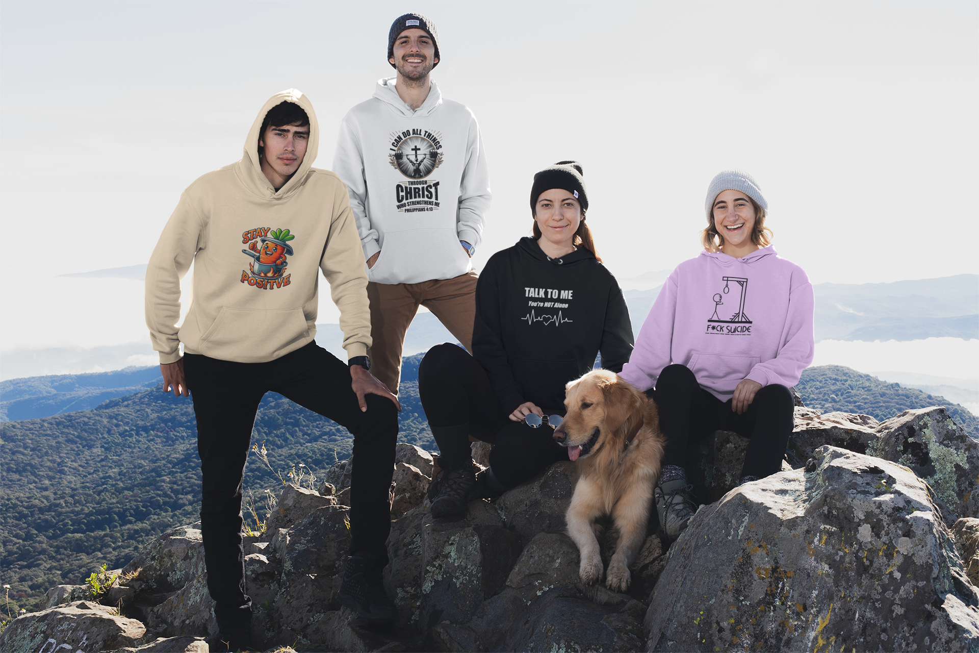 Group of four young adults and a golden retriever on a mountain summit, wearing colorful hoodies with various messages, against a backdrop of mountain ranges and cloudy sky.