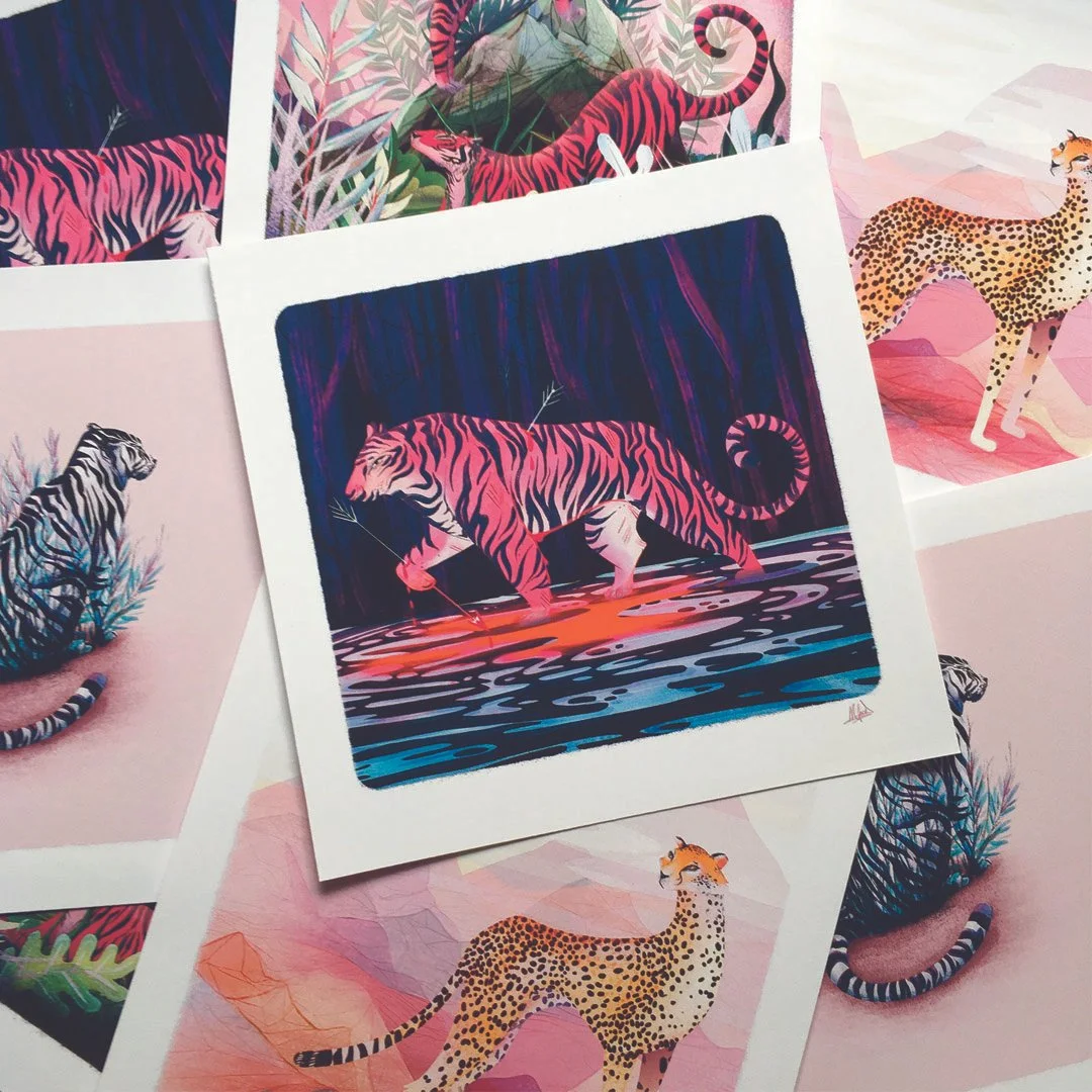 Set of illustrated art prints featuring stylised large cats, including tigers and cheetahs, with vibrant colours and landscape backgrounds full of foliage and stylised forms. 
