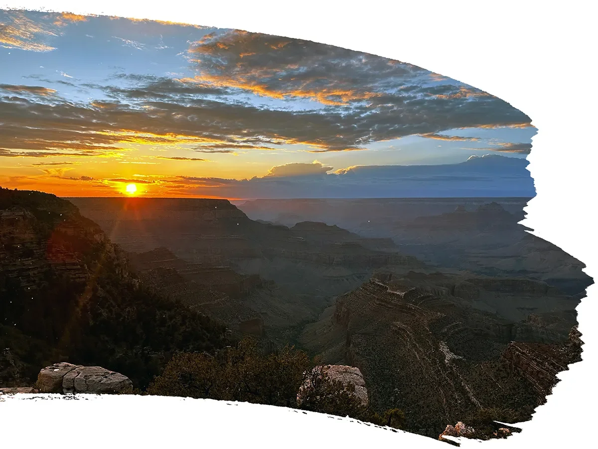 Sunset over the Grand Canyon with colorful sky and layered canyon cliffs