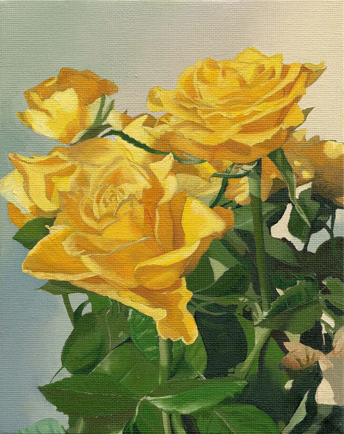 A bouquet of yellow roses with green leaves.