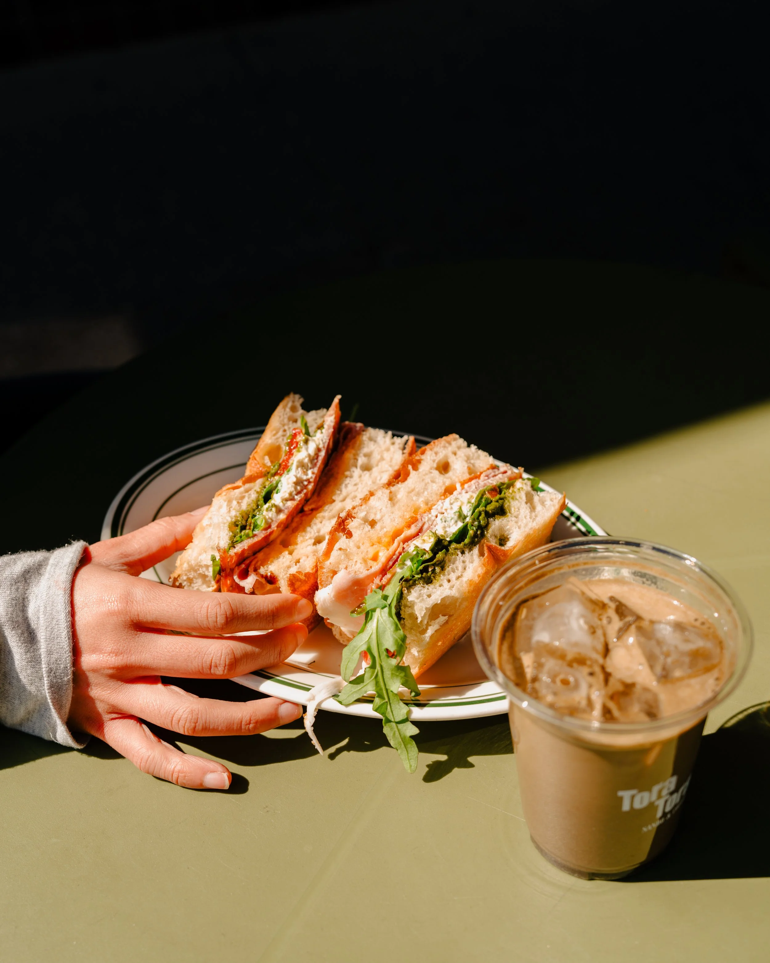 Specialty iced coffee and Japanese sando served at Tora Tora Japanese sandwich shop