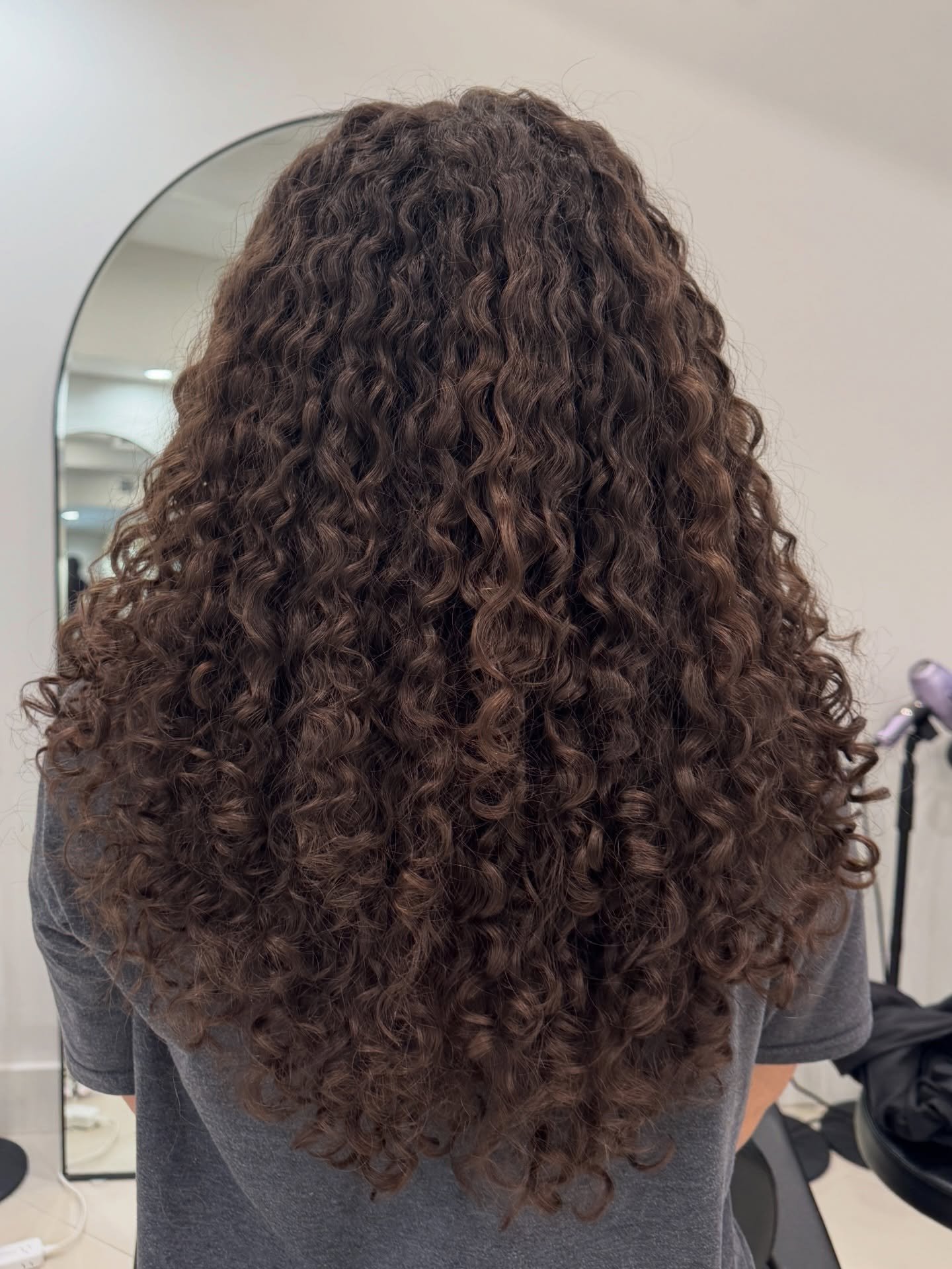 Long. Thick. Curly.

A combination that&rsquo;s absolutely beautiful... and requires a whole lot of balance.

When curly hair gets this long and dense, the goal isn&rsquo;t to remove as much hair as possible. The goal is to create movement while main