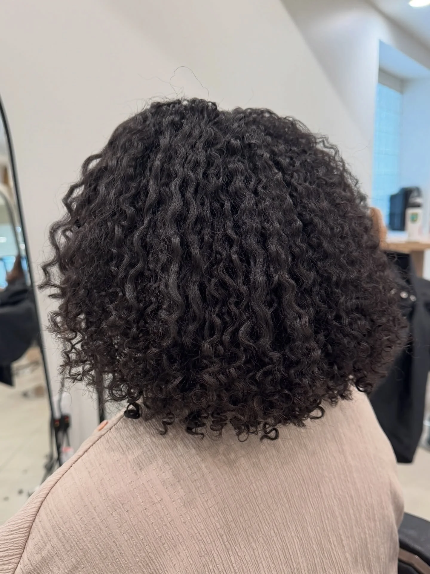 A corrective curly cut is about so much more than the haircut itself.

Yes, we&rsquo;re creating balance within the shape. We&rsquo;re connecting layers, removing what isn&rsquo;t serving the curls, and building a structure that supports natural move