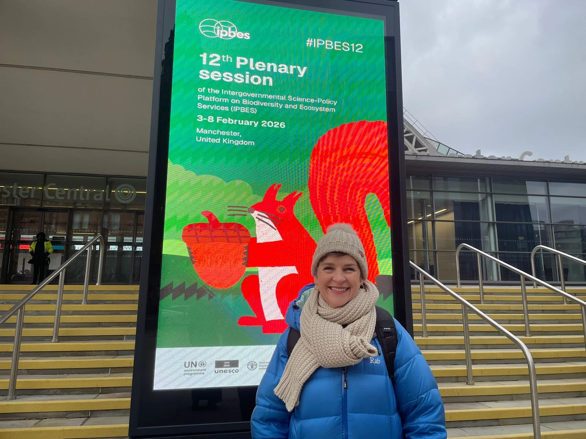 Mary outside ipbes12 sign.jpeg