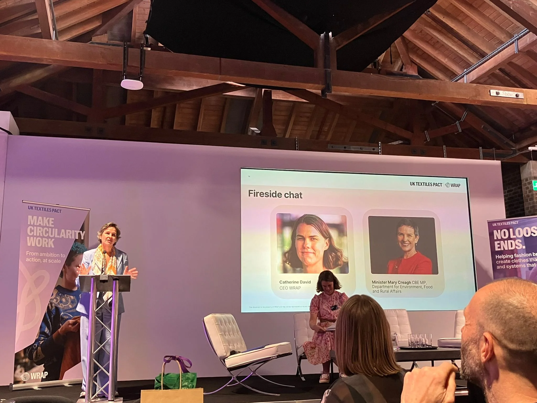 MC - speaking at podium WRAP UK.jpg