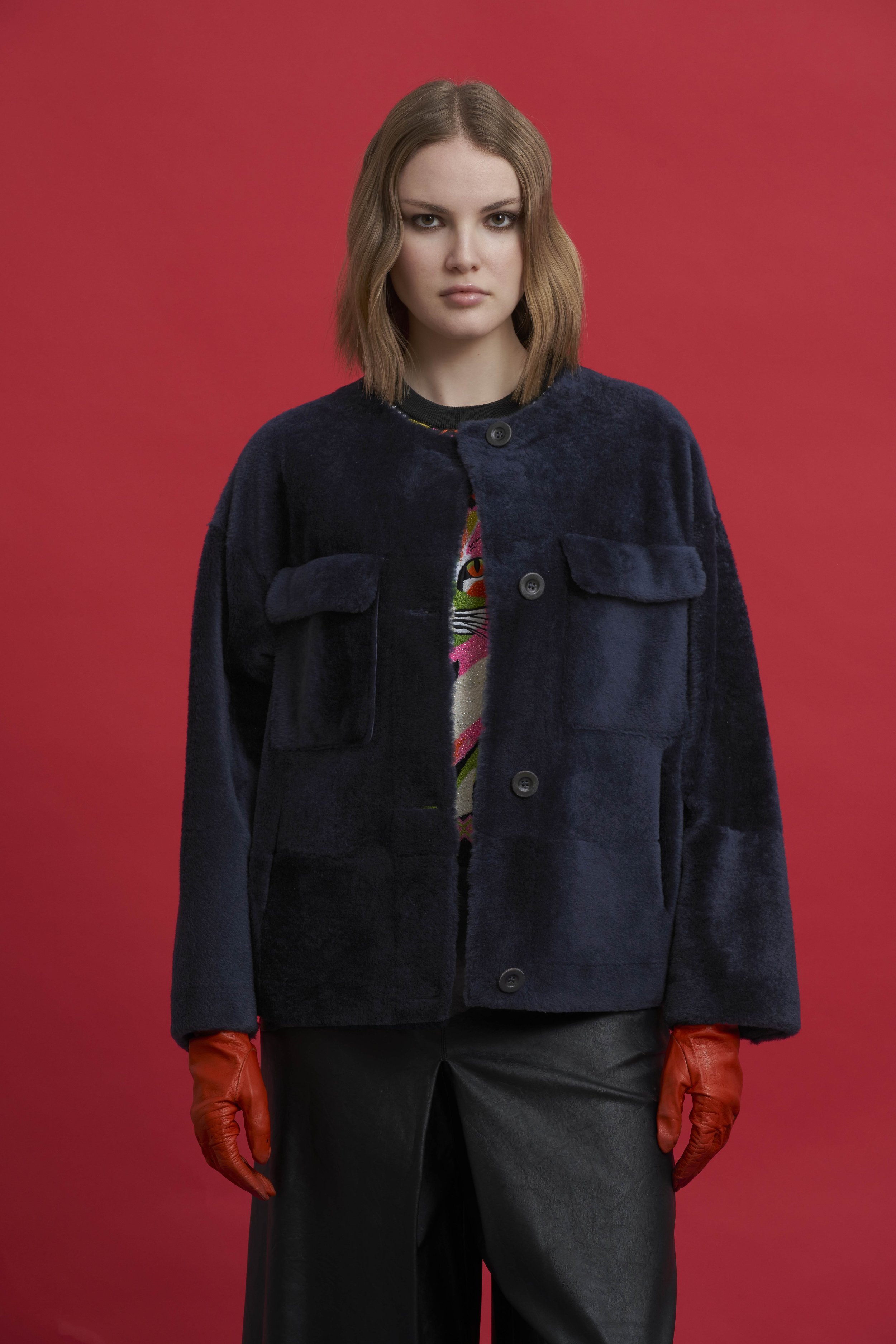 Giacca shearling blu navy con tasche frontali