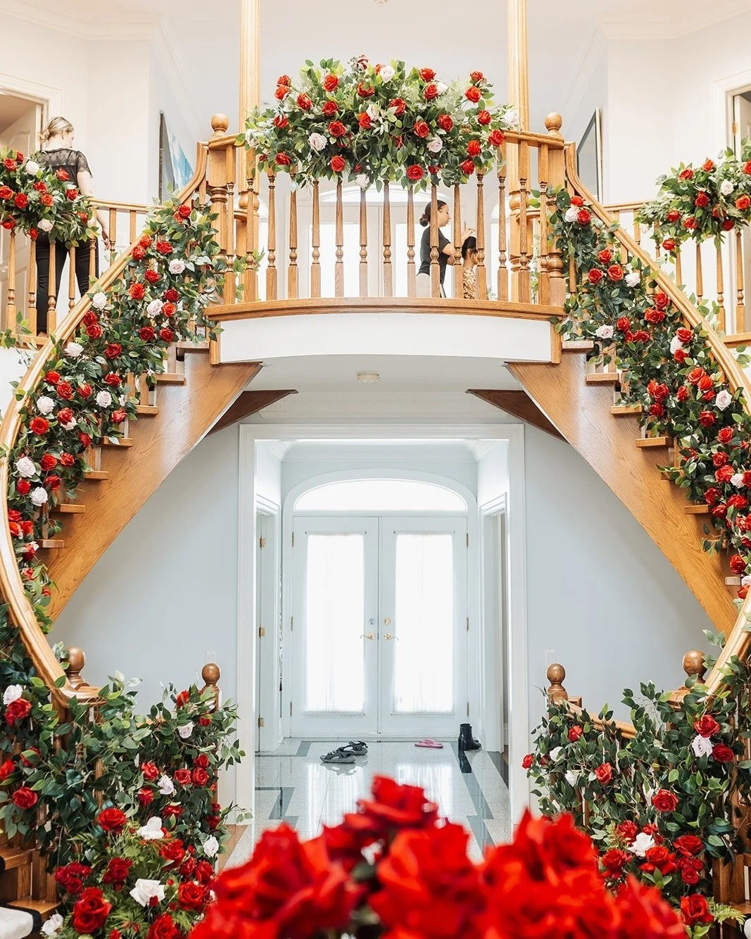 A staircase made for romance&mdash;bold red roses and cascading greenery. We transformed this entrance into a showstopping floral installation. 

#TorontoWeddings #LuxuryWeddingsToronto #HighEndWeddings #TorontoBrides
#TorontoEventPlanners #LuxuryWed