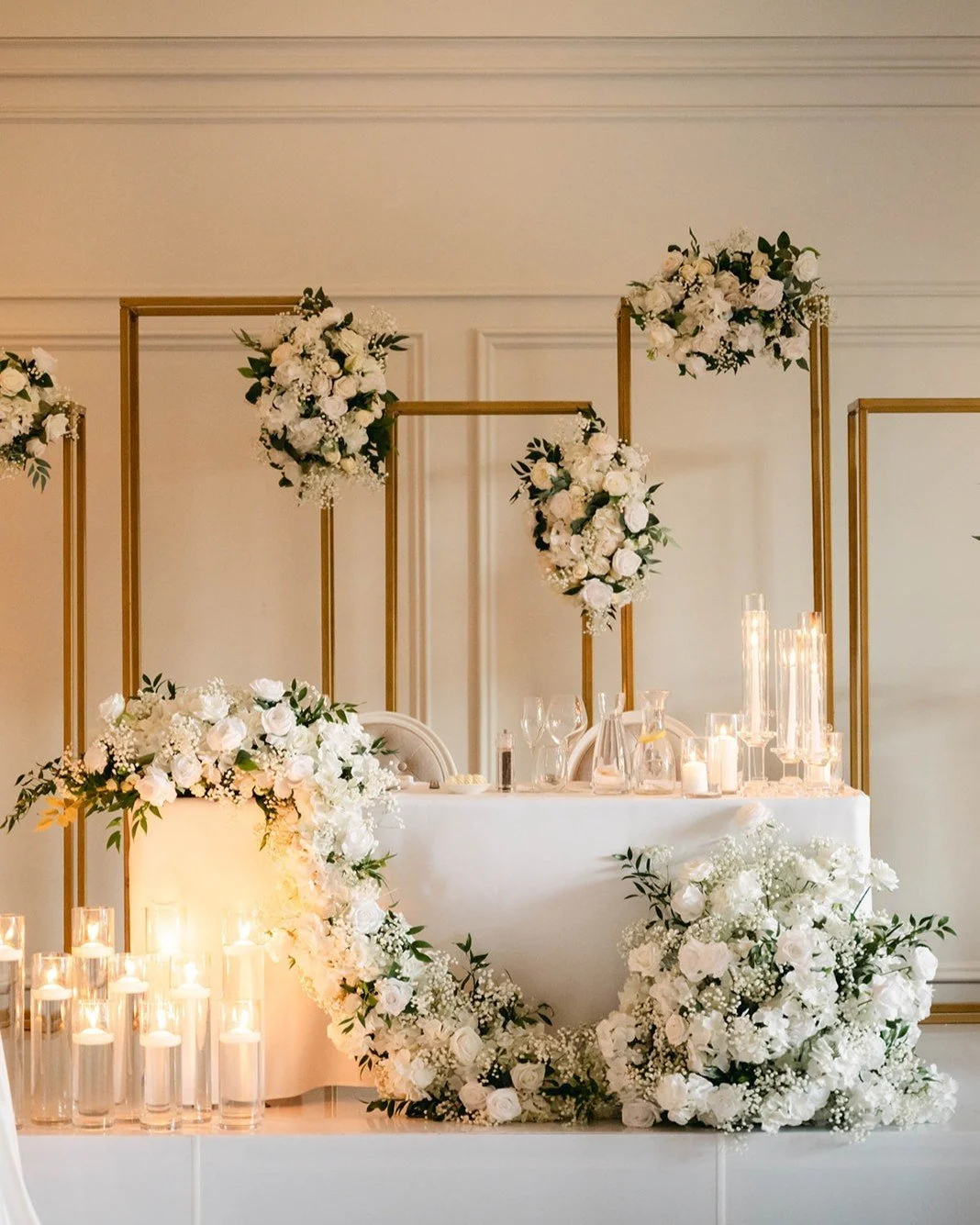 Golden hour, indoors. A luxurious floral and candle lit reception setup with cascading white blooms, soft roses, and our elegant gold frame installations. A romantic, sophisticated celebration to remember.
⠀⠀
🕯️ Candlelit Wedding Reception
🌼 White 