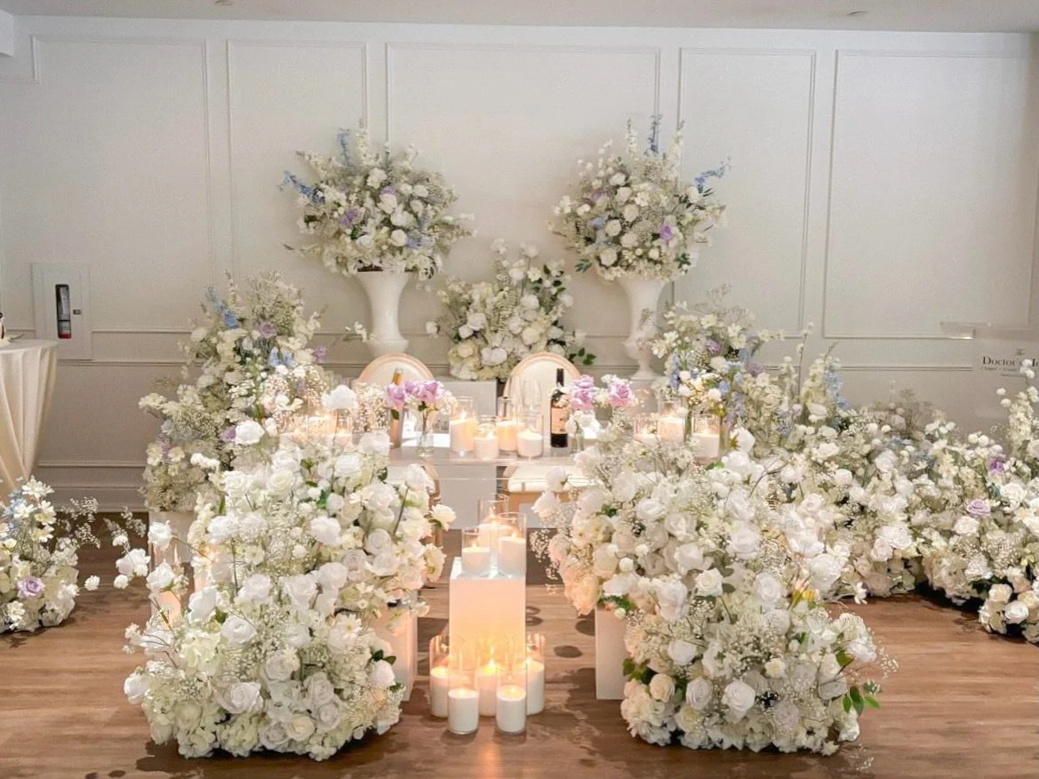 S &amp; M's Western Wedding at The Doctor's House 

Surround yourself with timeless beauty on your special day. This dreamy setup features lush white roses, delicate baby&rsquo;s breath, and soft pastel blooms&mdash;crafted to create the perfect fair