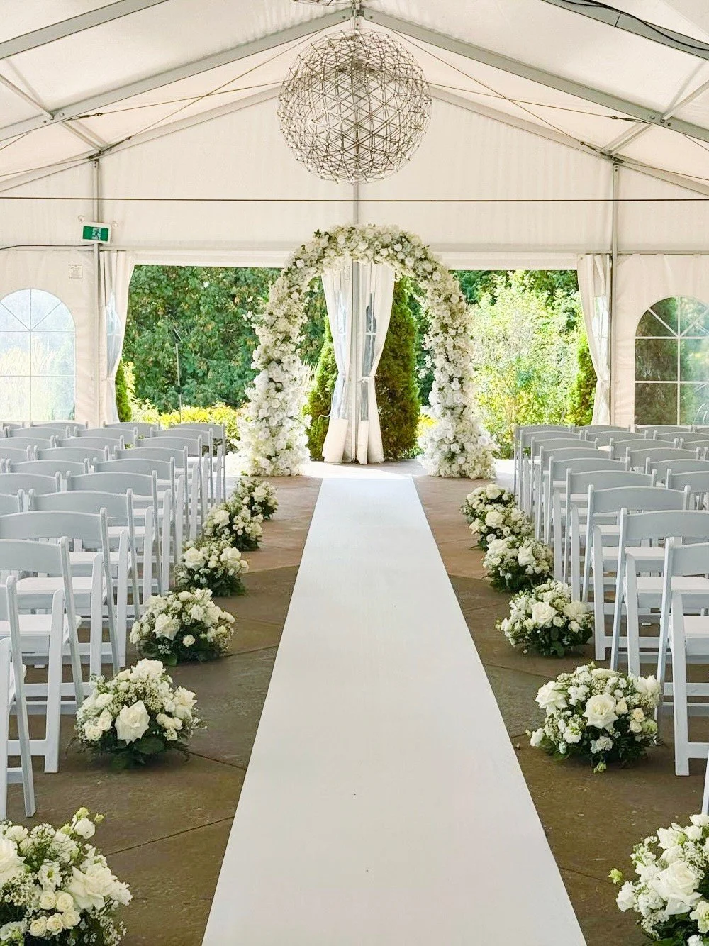 Suji &amp; Michael's ceremony florals. 

✨ Lomey plate arrangement
✨ Reversed U Arch
✨ White and green florals 
✨ Aisle markers 
✨ Aisle runner

All provided by Bloomberry &amp; Co