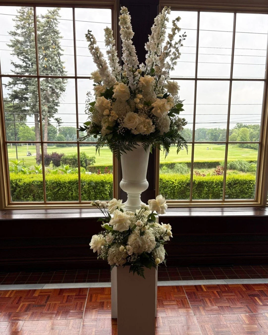 A timeless floral statement designed to elevate the space ✨
Lush white blooms layered with soft greenery, styled on classic pedestals to create an elegant focal point for ceremonies, entrances, or reception spaces.

#weddingflorals #ceremonyflowers #