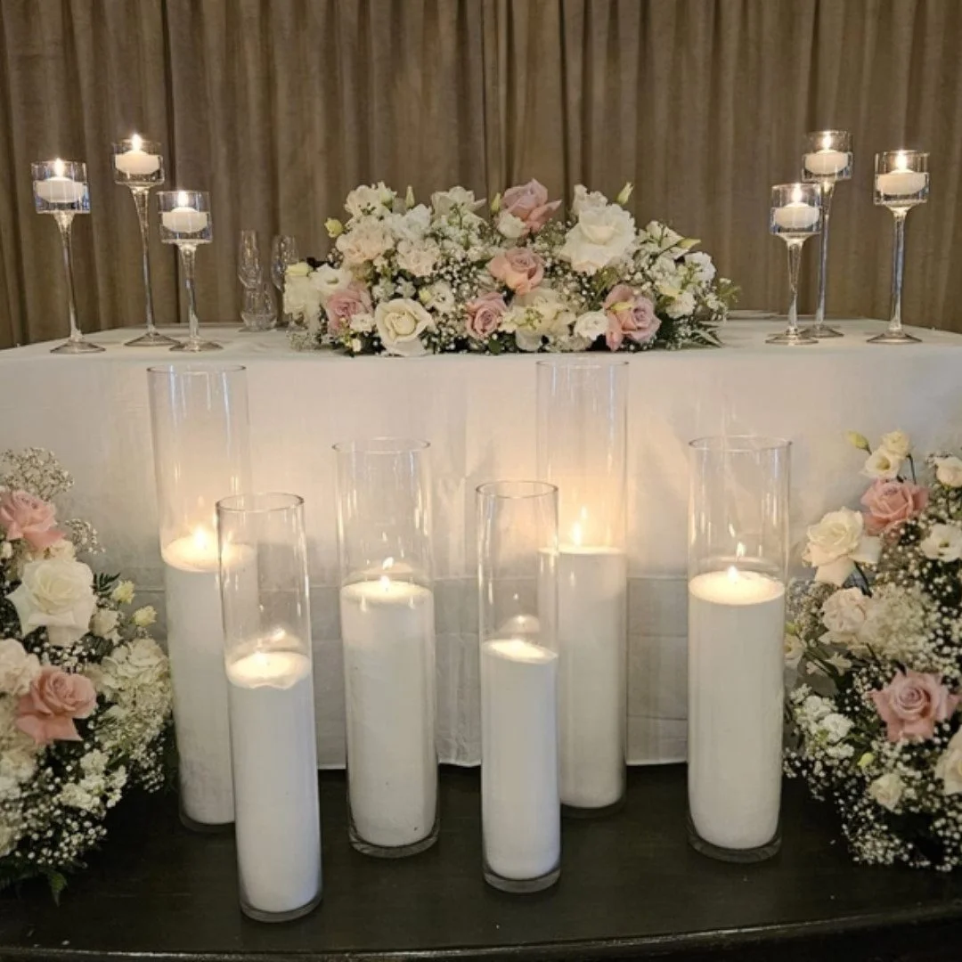 The head table layered with romance, texture, and timeless florals 🤍 With monet candles, sand wax candles and swag arrangements.

Designed for an unforgettable reception atmosphere.

#headtable #weddingreceptiondecor #luxuryweddingflorals #romanticw