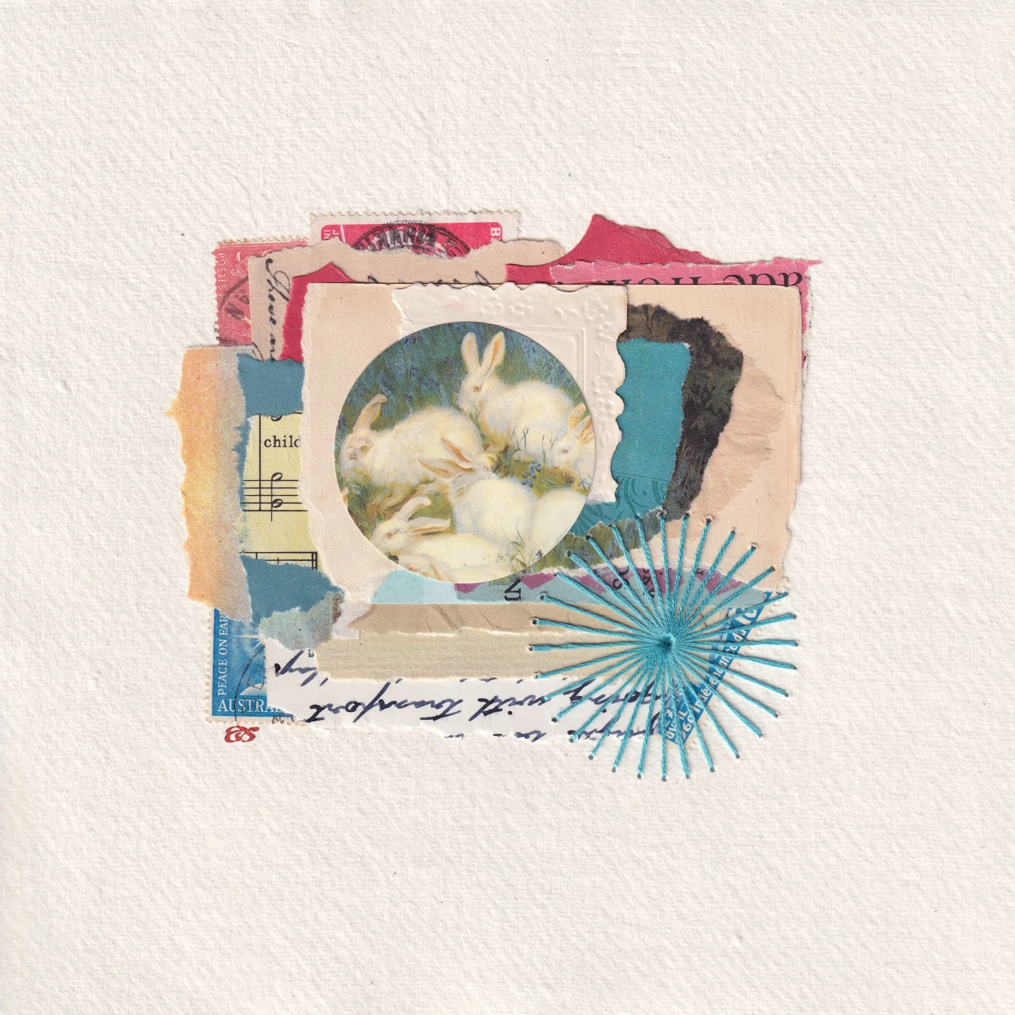 Vintage image of delightful little, white, rabbits on antique blues and pinks. Handmade using vintage paper, ephemera and embroidery