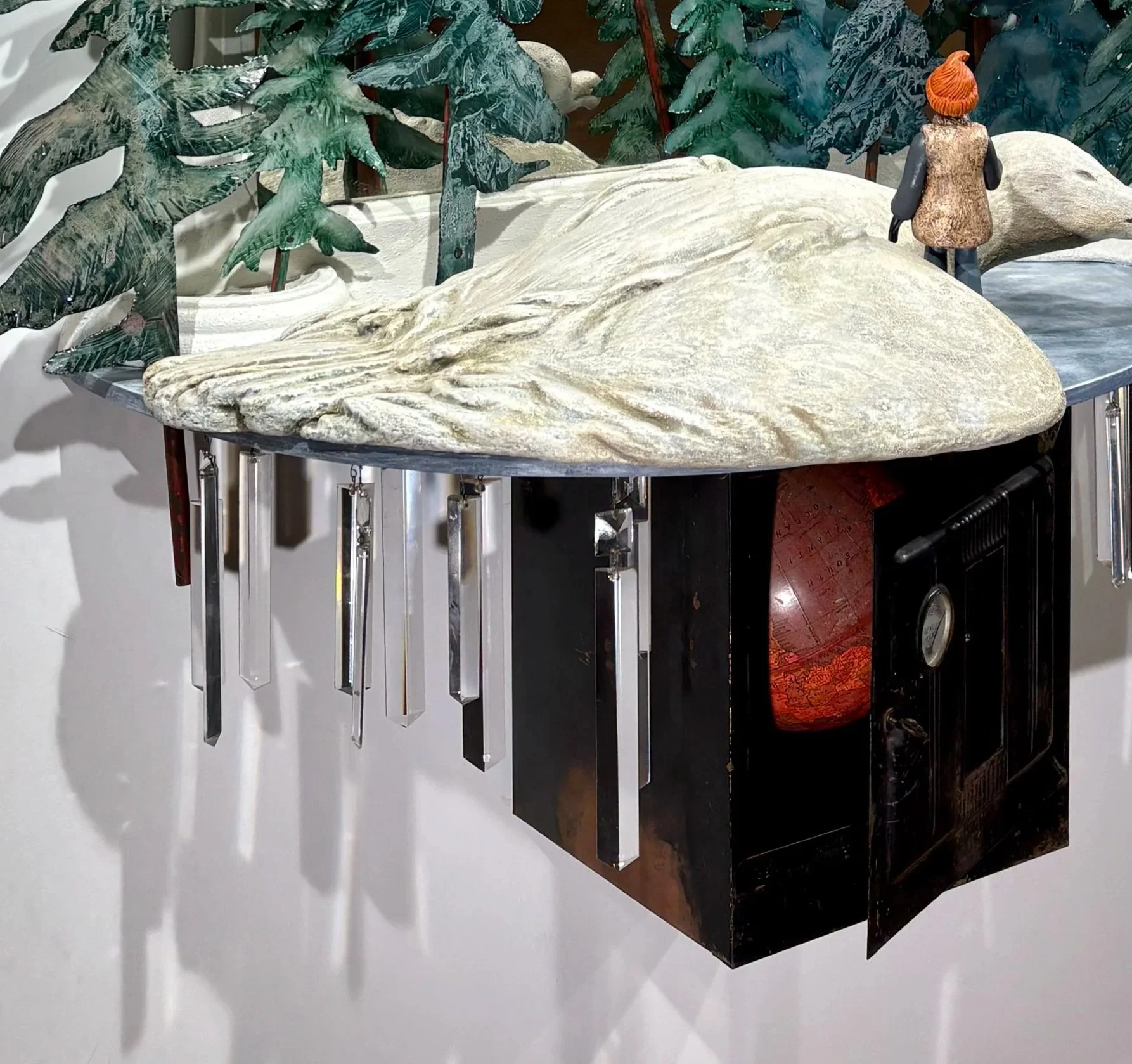 Portrait of the Seagull's Keeper, detail with carved recycled styrofoam seagull, oven with globe, and ice crystals