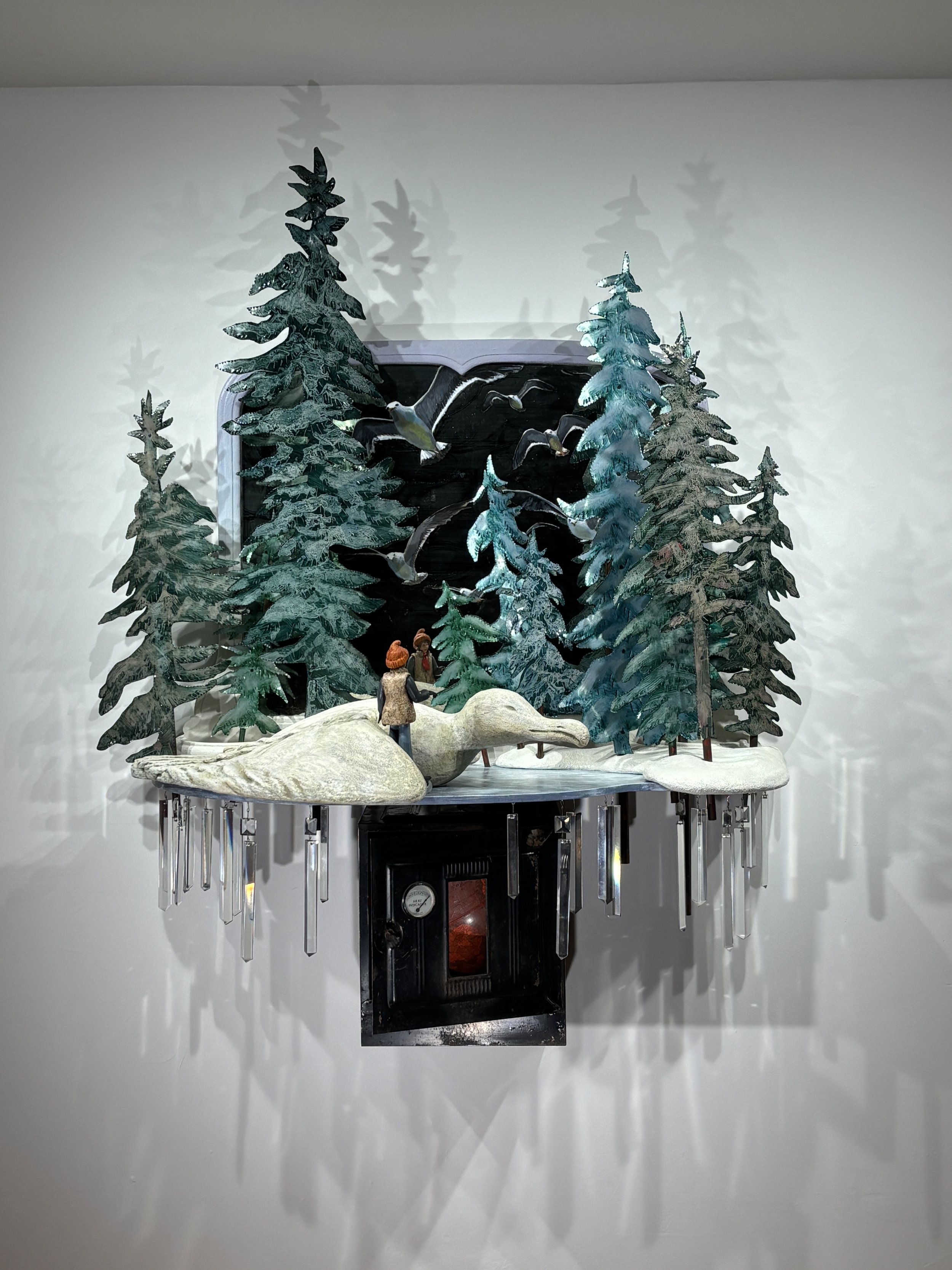 Portrait of the Seagull's Keeper, 2024, wall assemblage with vintage wood mirror, wood, carved recycled Styrofoam, metal, vintage action figure altered with epoxy and wood, found metal oven, globe, vintage crystals, oil and acrylic paint, 55 ¼ “H x 4