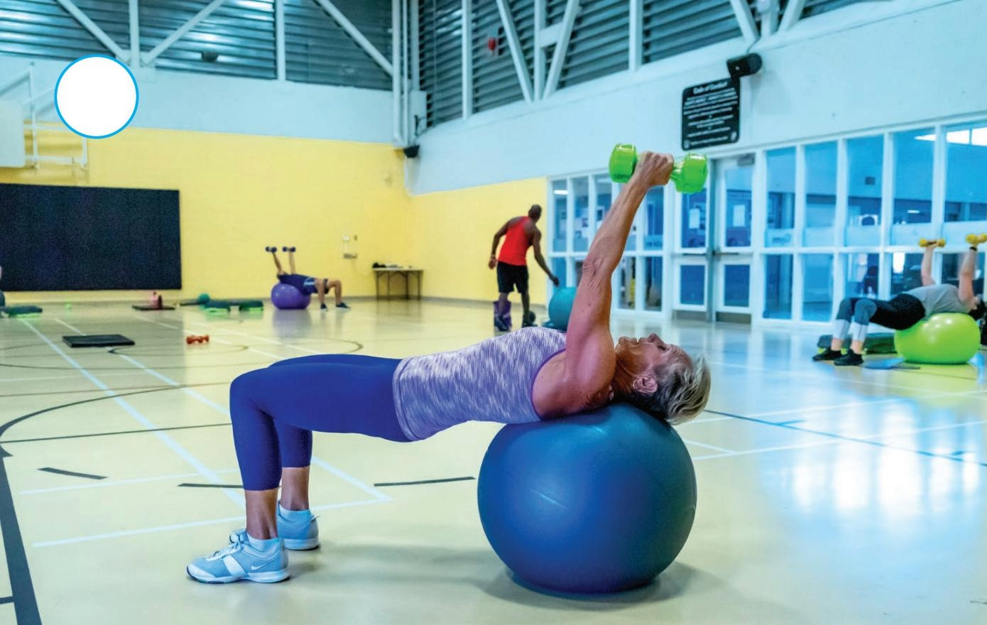 Signboard in front of Royal Jubilee Hospital showing directions to emergency, B.C. Cancer Agency, D T Centre, Memorial Pavilion, Patient Care Centre, and Visitor Parking, with a large hospital building in the background.