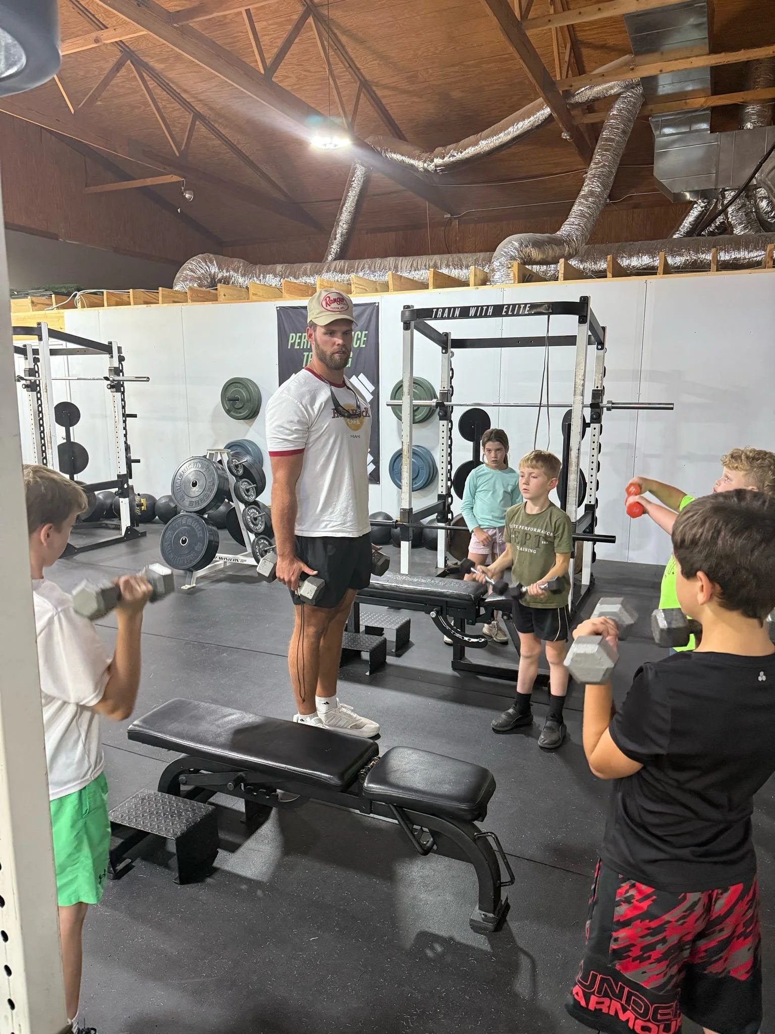 Youth group class training upper body with Coach Jackson.