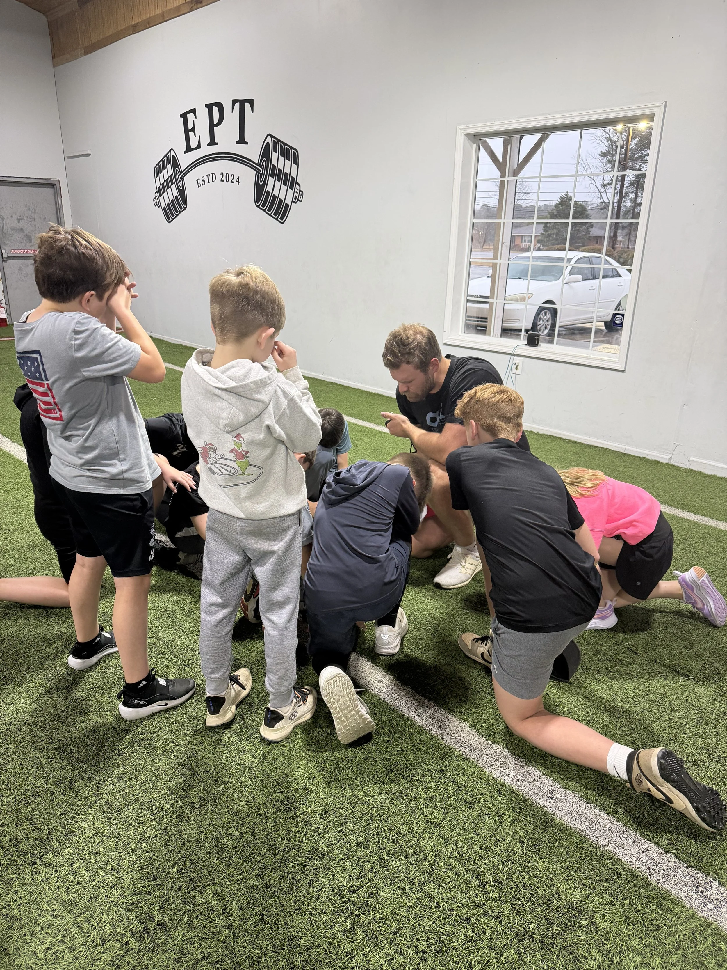 Coach Jackson praying for our EPT Youth Class. Developing athletes physically and mentally!