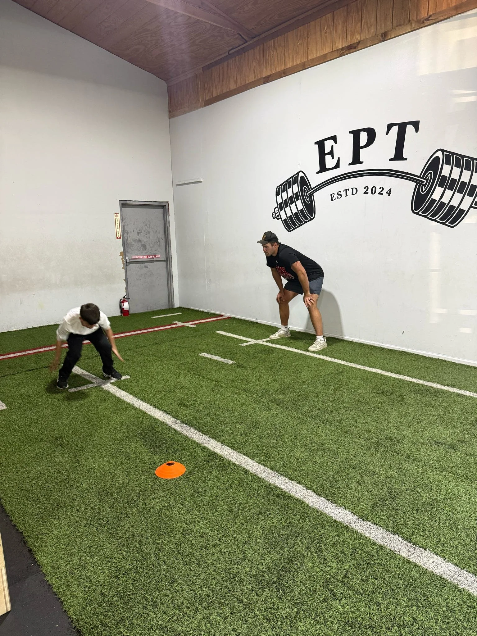 Coach Jackson in a one on one session with an athlete.