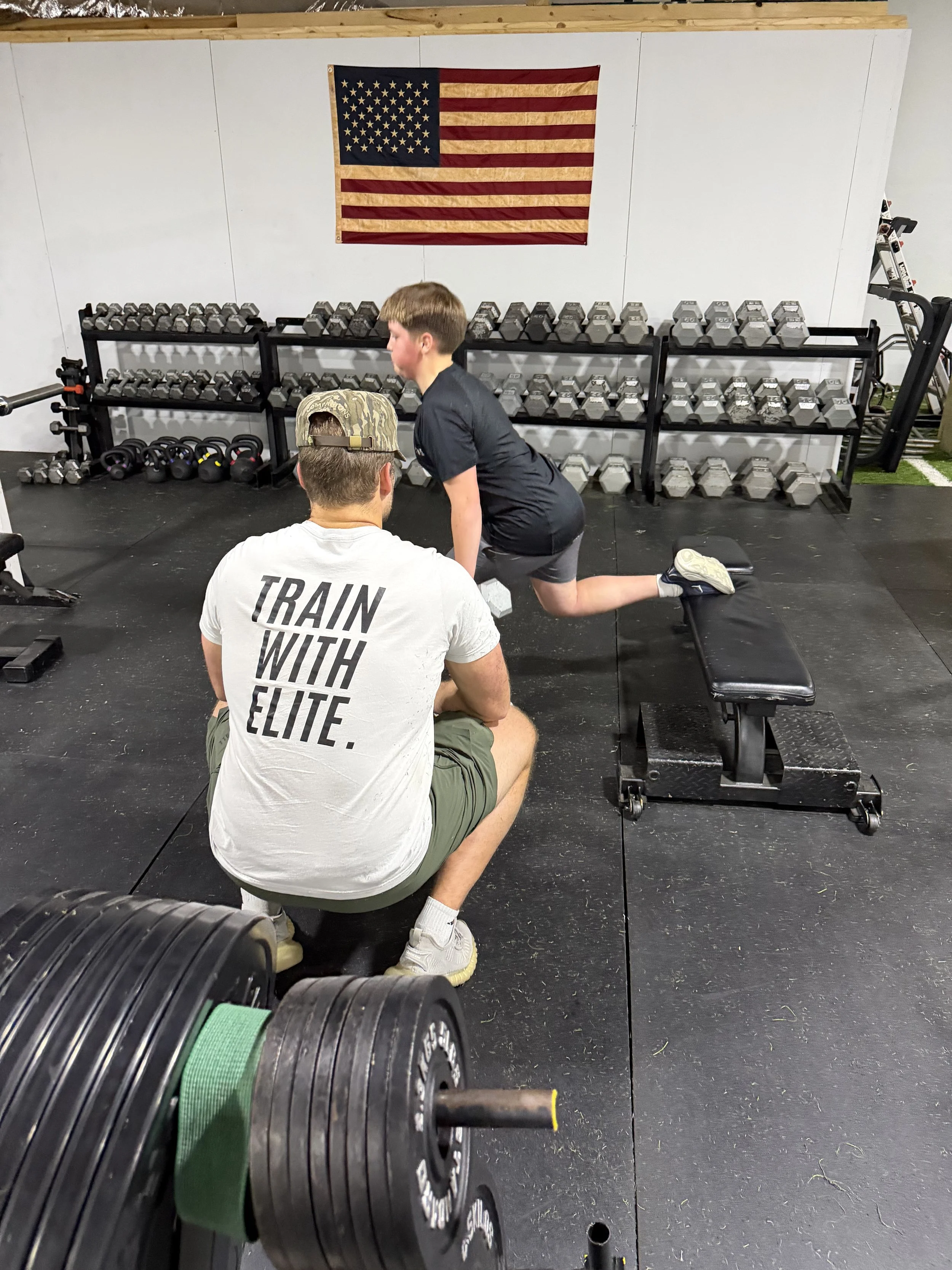 Leg day at EPT. Athlete is doing Bulgarian split squats with coach jackson.