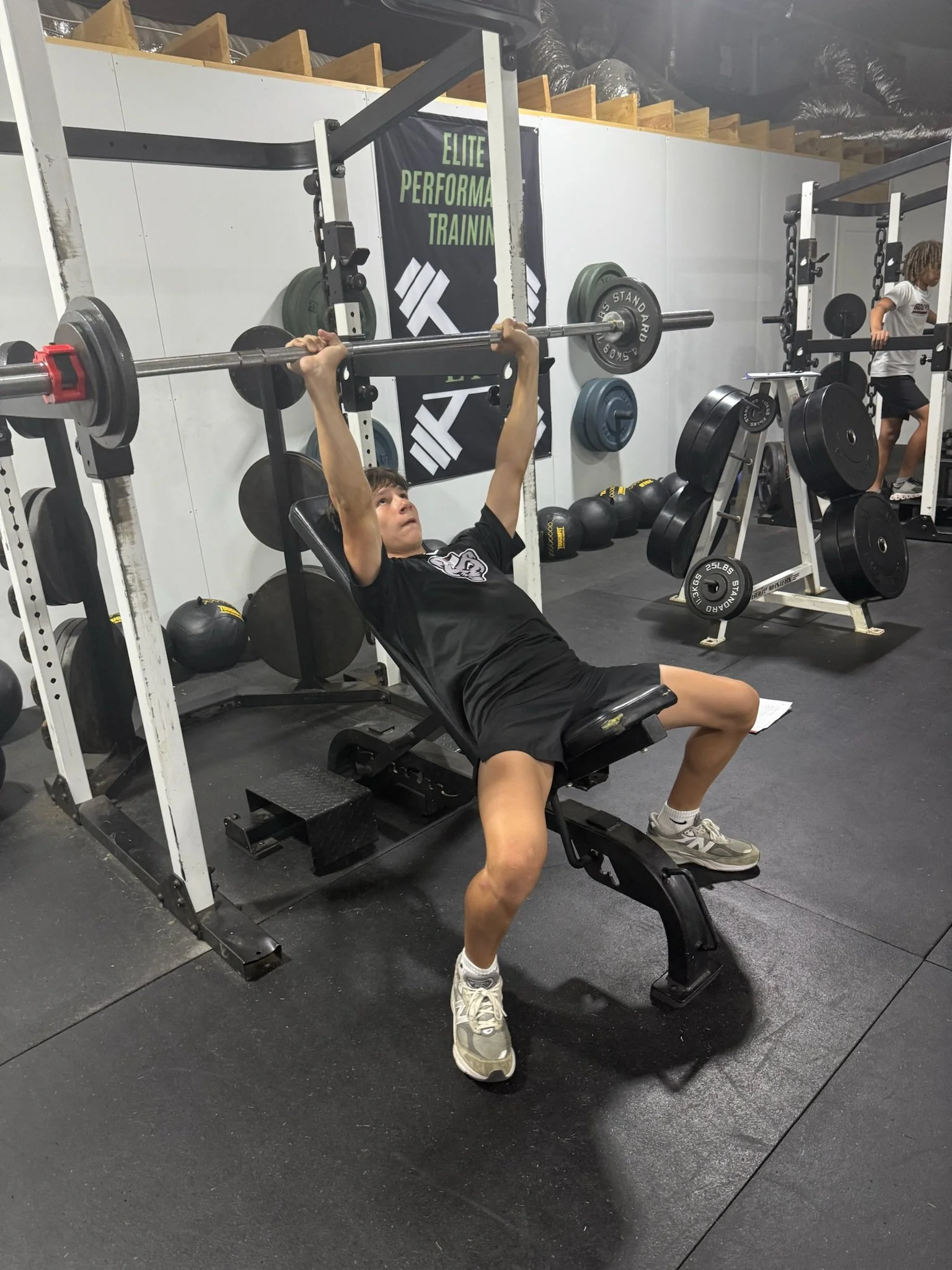 Athlete bench pressing on upper body day.