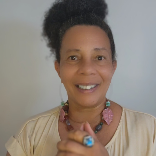 Demetriah Annenayah smiling brightly, founder and guide of the Soul Contract Strategy and Sacred Feminine Design.