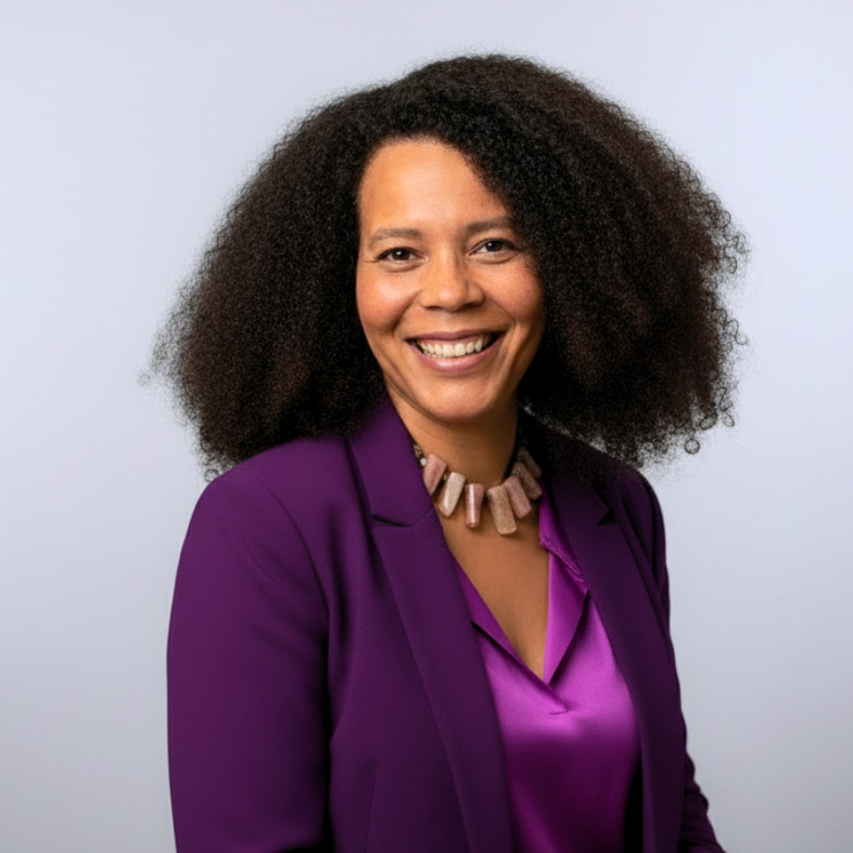 Smiling confident professional Demetriah Annenayah in her signature purple and pink