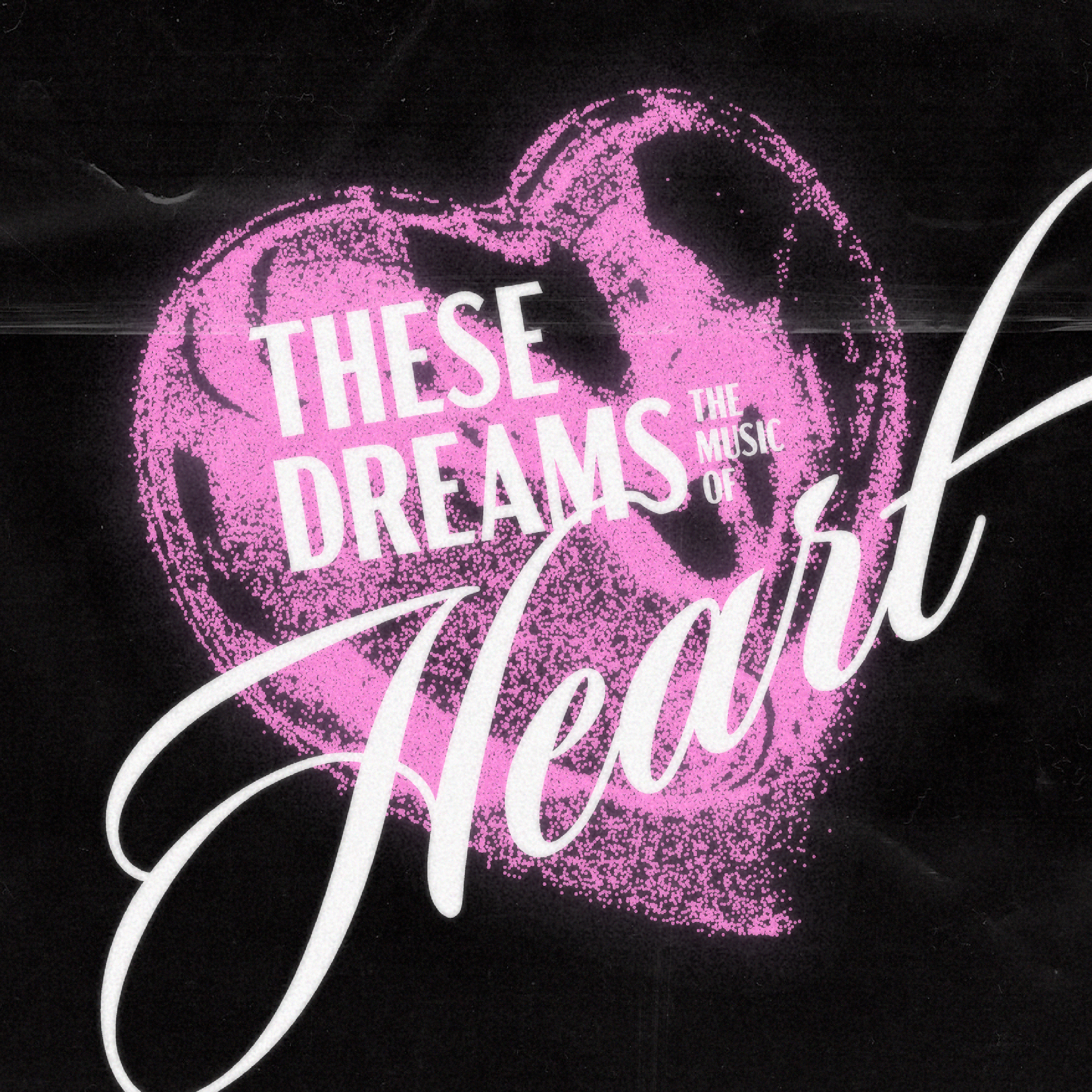 Text on a black background says "These Dreams: The Music of Heart" in pink and white with a pink heart design.