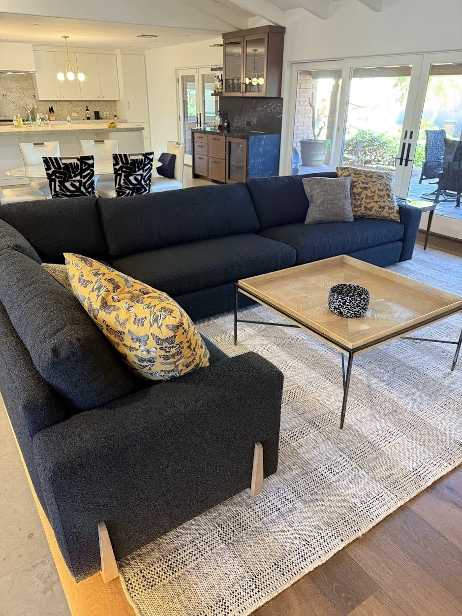 Designed exclusively for this Paradise Valley residence, every element in this space was custom-curated—from the art and furnishings to the architectural detailing. The one-of-a-kind sectional features hand-bent wood framing and tailored upholstery s