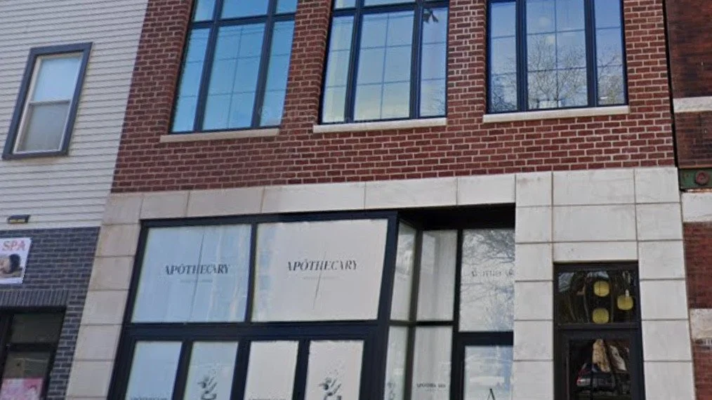 Renovated three-story brick and limestone mixed-use building with a restaurant storefront in Lakeview, Chicago