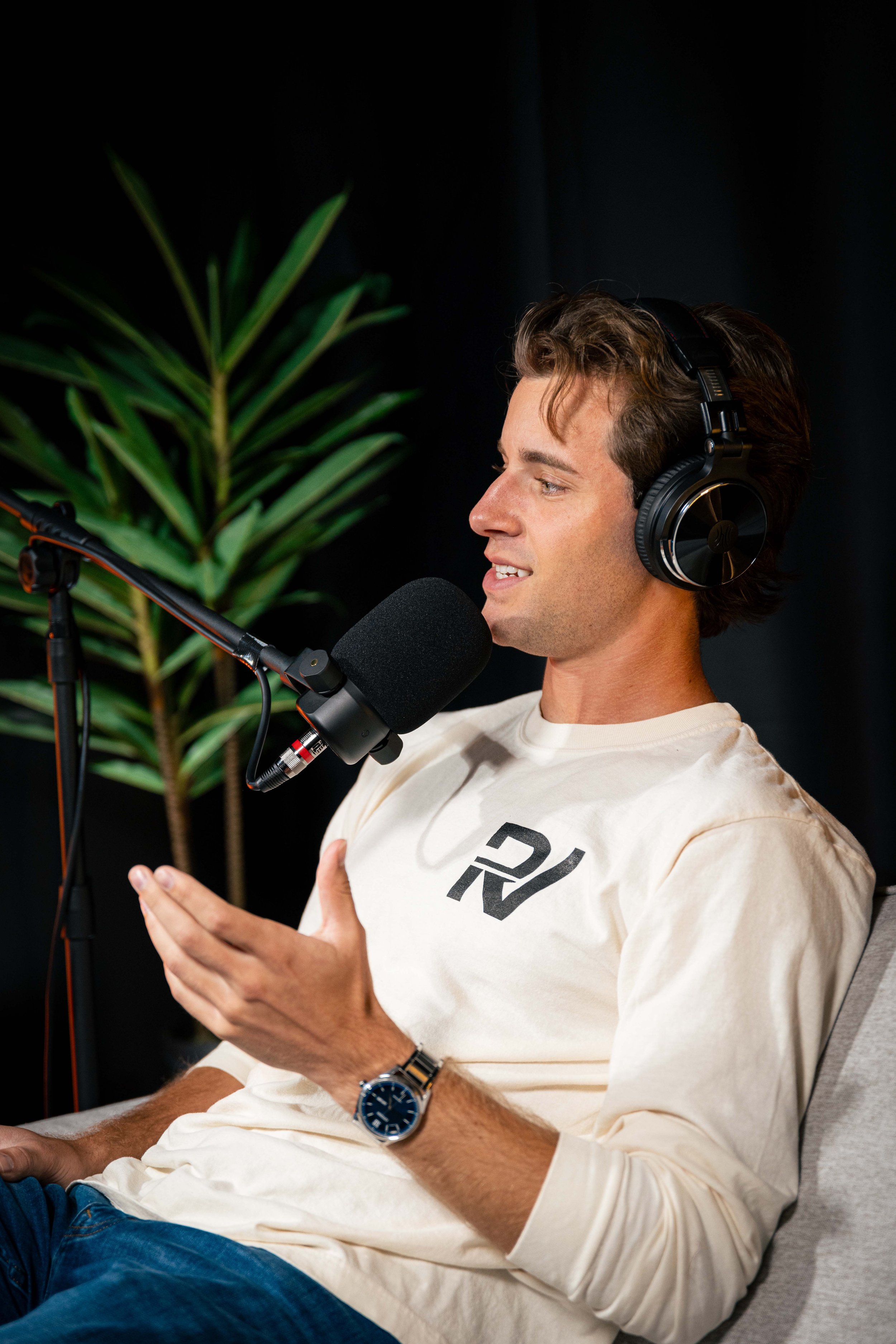 Owner of RenVision Media on a podcast set at RenVision Media Podcast Studios