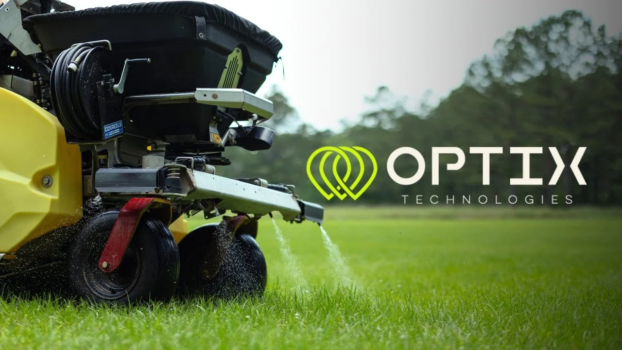 Lawn mower watering grass with OPTRIX Technologies logo and name on the right side.