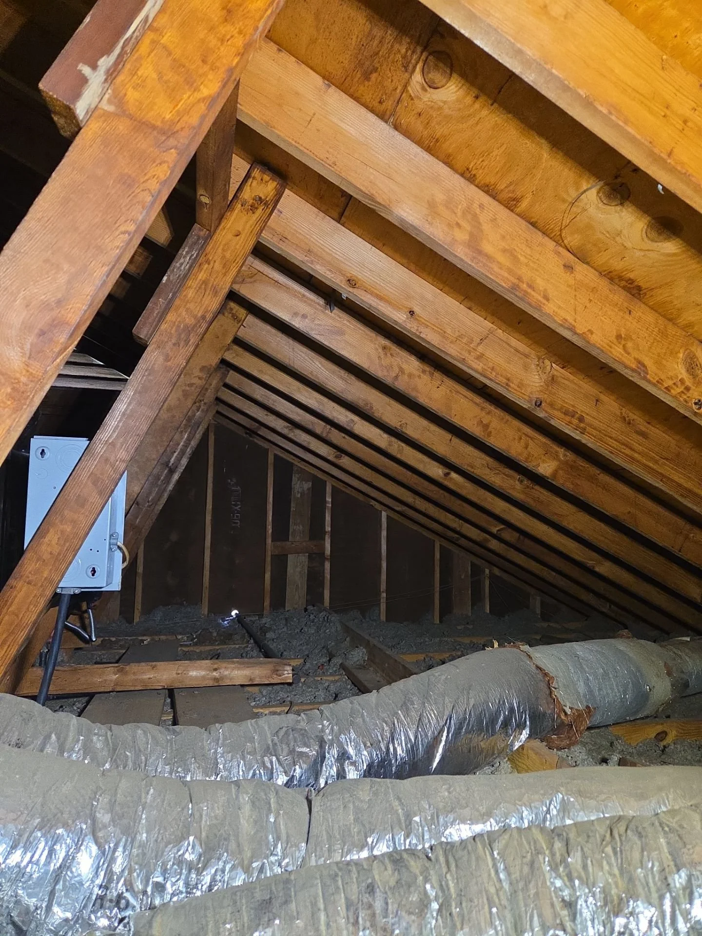 Why Your Attic Is Making Your House Hot — And What Your Roof Has to Do With It
