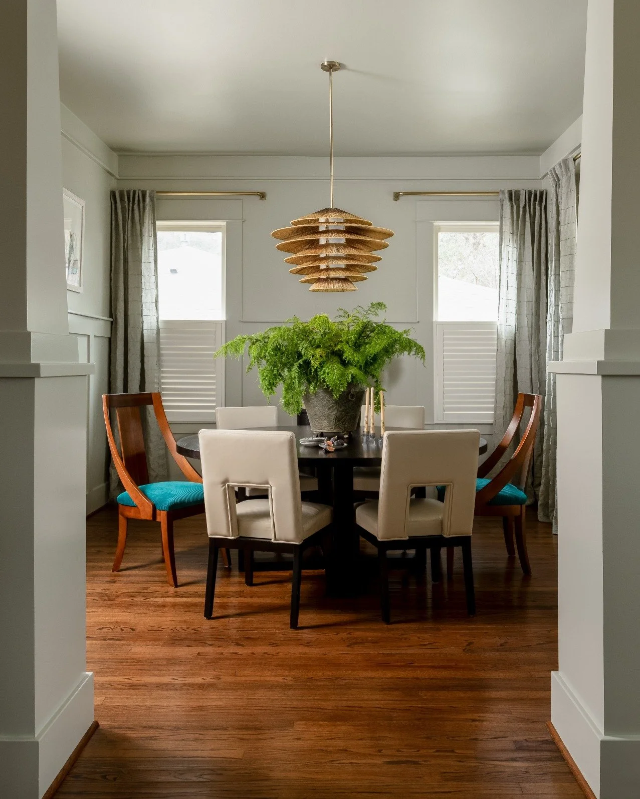 --Before &amp; After Magic--

Same dining table. Same chairs. Completely different vibe.

By layering in grasscloth wallpaper for warmth and texture, adding custom paneling in a color-drip finish for depth, and thoughtfully styling the space, we gave
