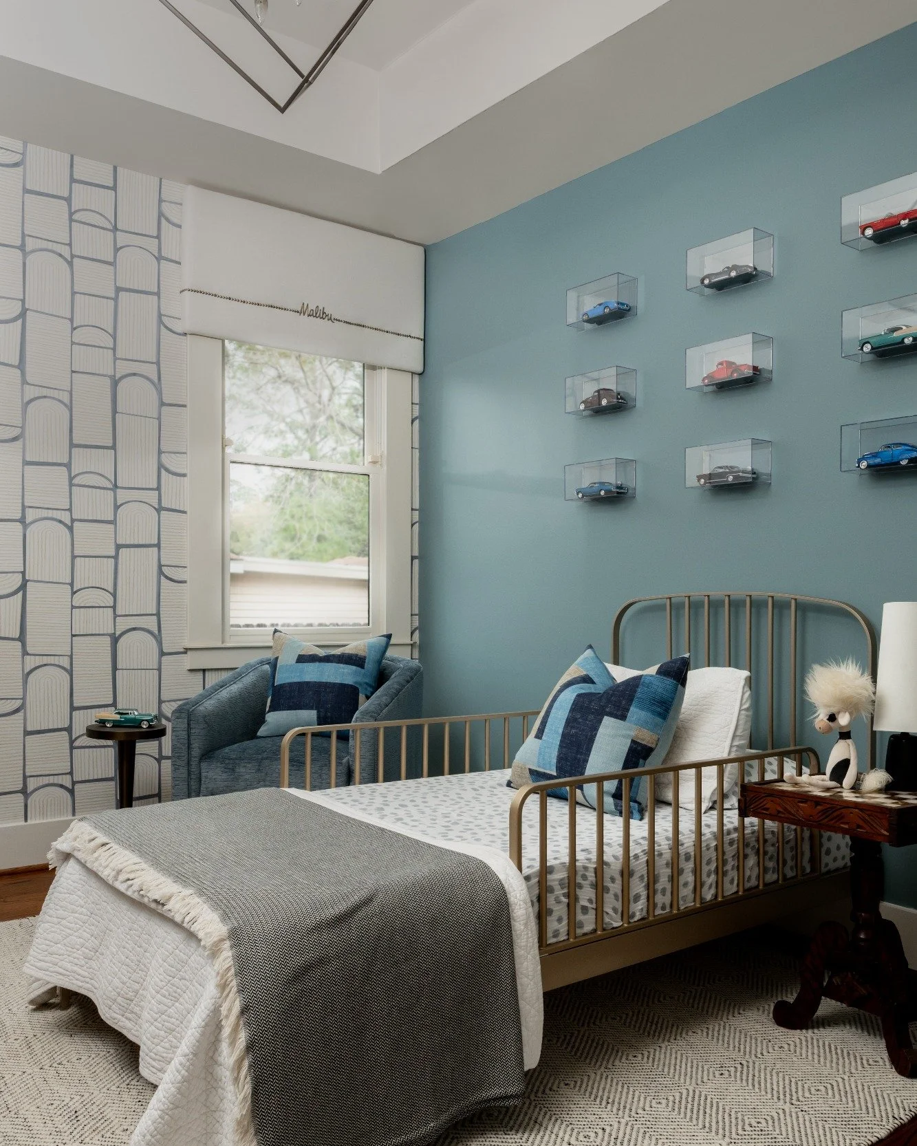 From plain to personality-packed 
This bedroom started as a blank slate. Our goal: design a space that felt youthful yet refined, with plenty of room for hobbies and future growth.

Swipe to see how we layered color, pattern, and personalized details