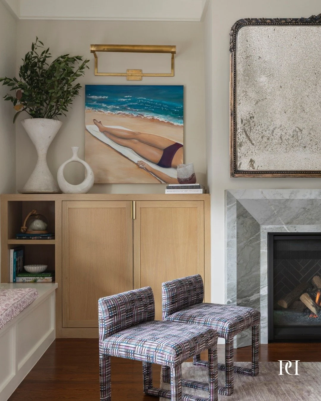 Where gatherings feel effortless

We redesigned this space with the holidays in mind &mdash; a place for conversation, comfort, and connection. The custom fireplace brings a quiet sense of luxury, while white oak cabinetry provides both warmth and th