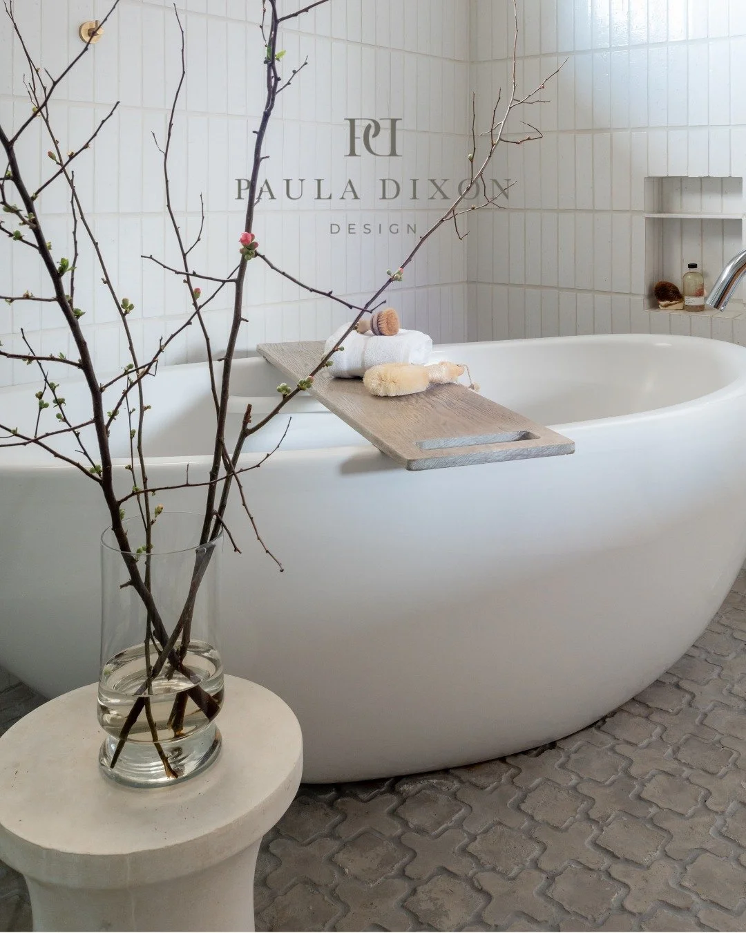 Quiet luxury lives in the details &mdash; the soft curve of a soaking tub, the texture of hand-laid tile, the balance of minimalism and warmth.

This bathroom was designed as a retreat &mdash; where natural materials and refined simplicity meet to cr