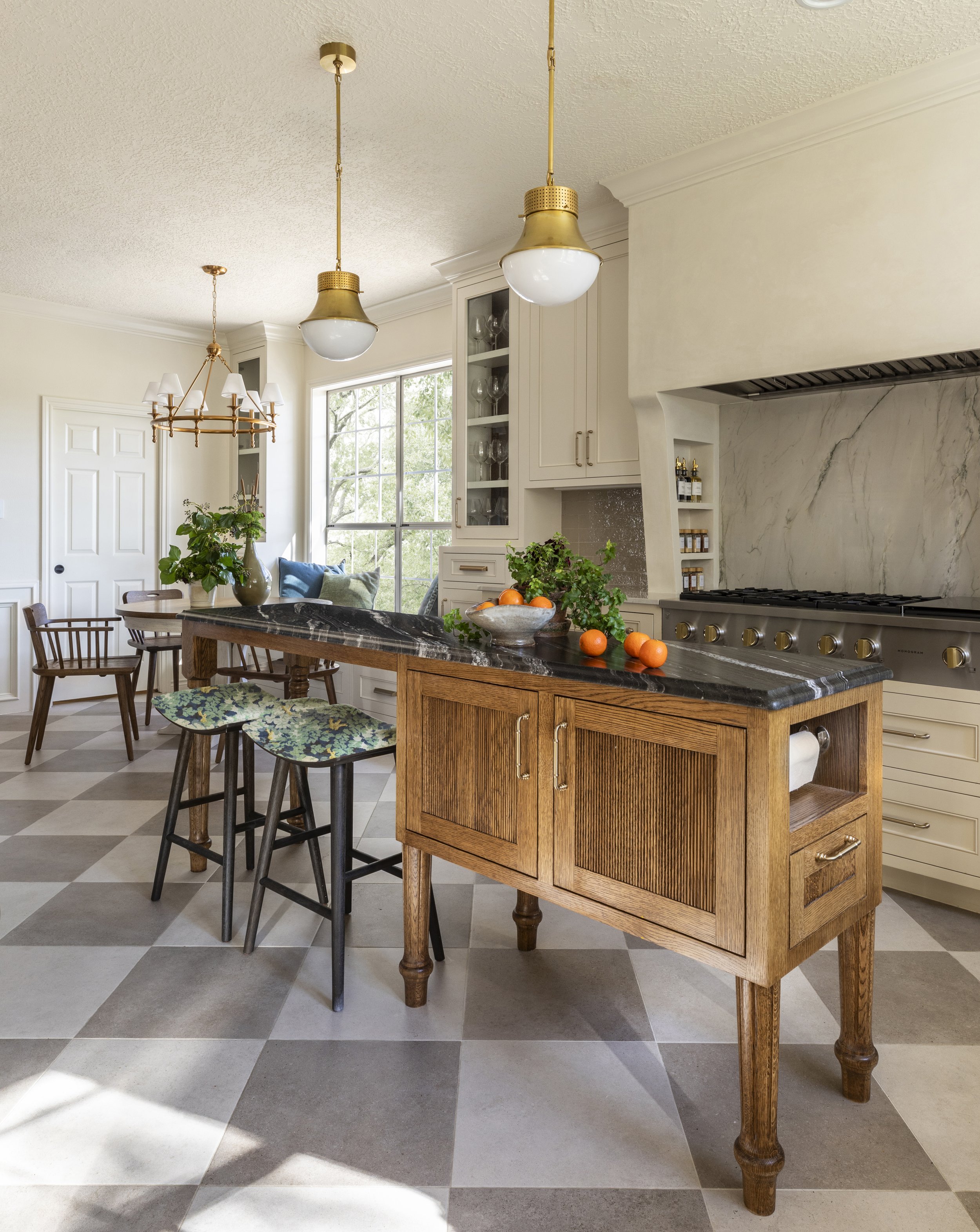 Custom stained wood island designed by interior design firm Paula Dixon Design. 