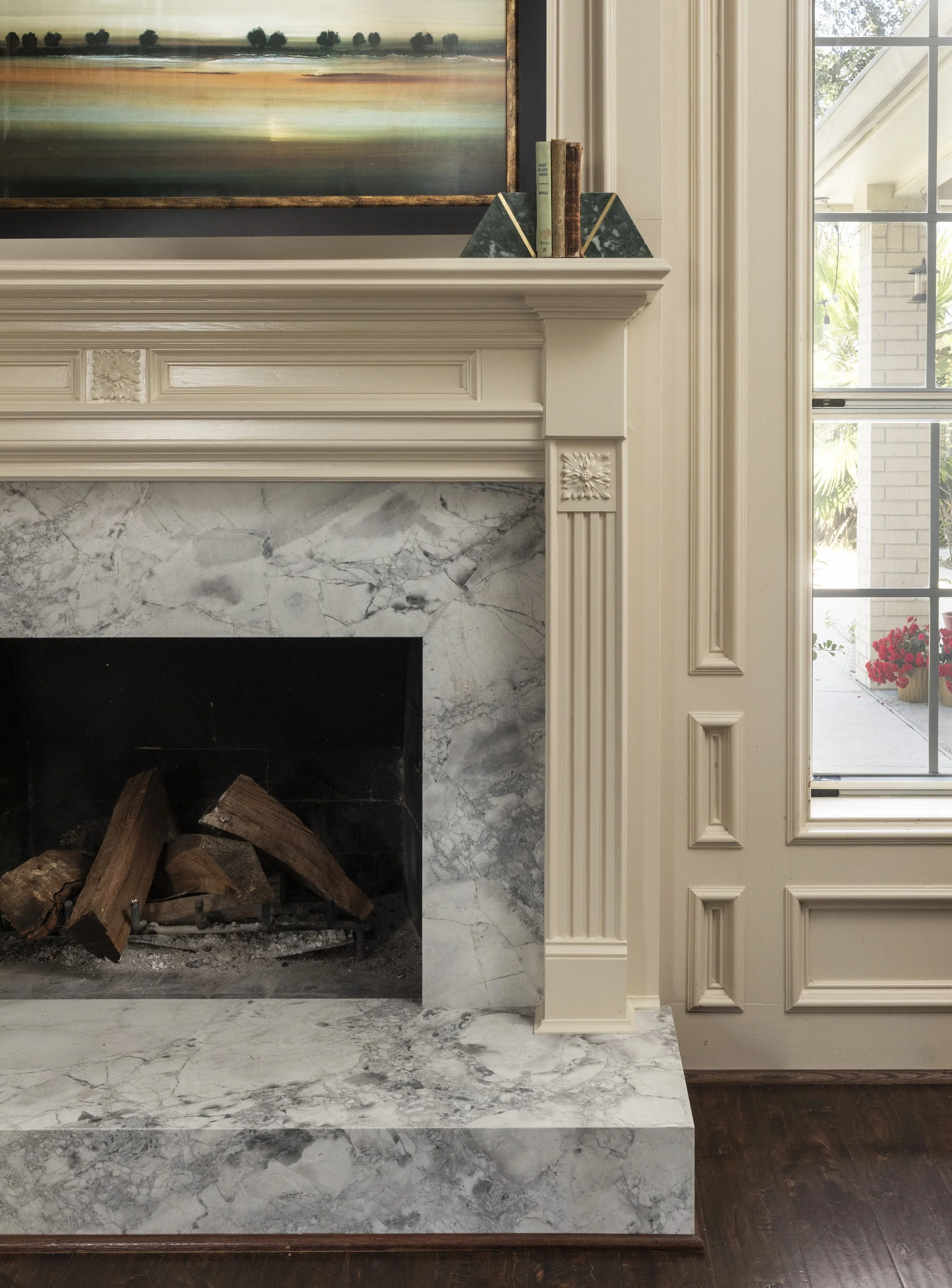 Honed quartzite fireplace mantel designed by Houston design firm Paula Dixon Design. 
