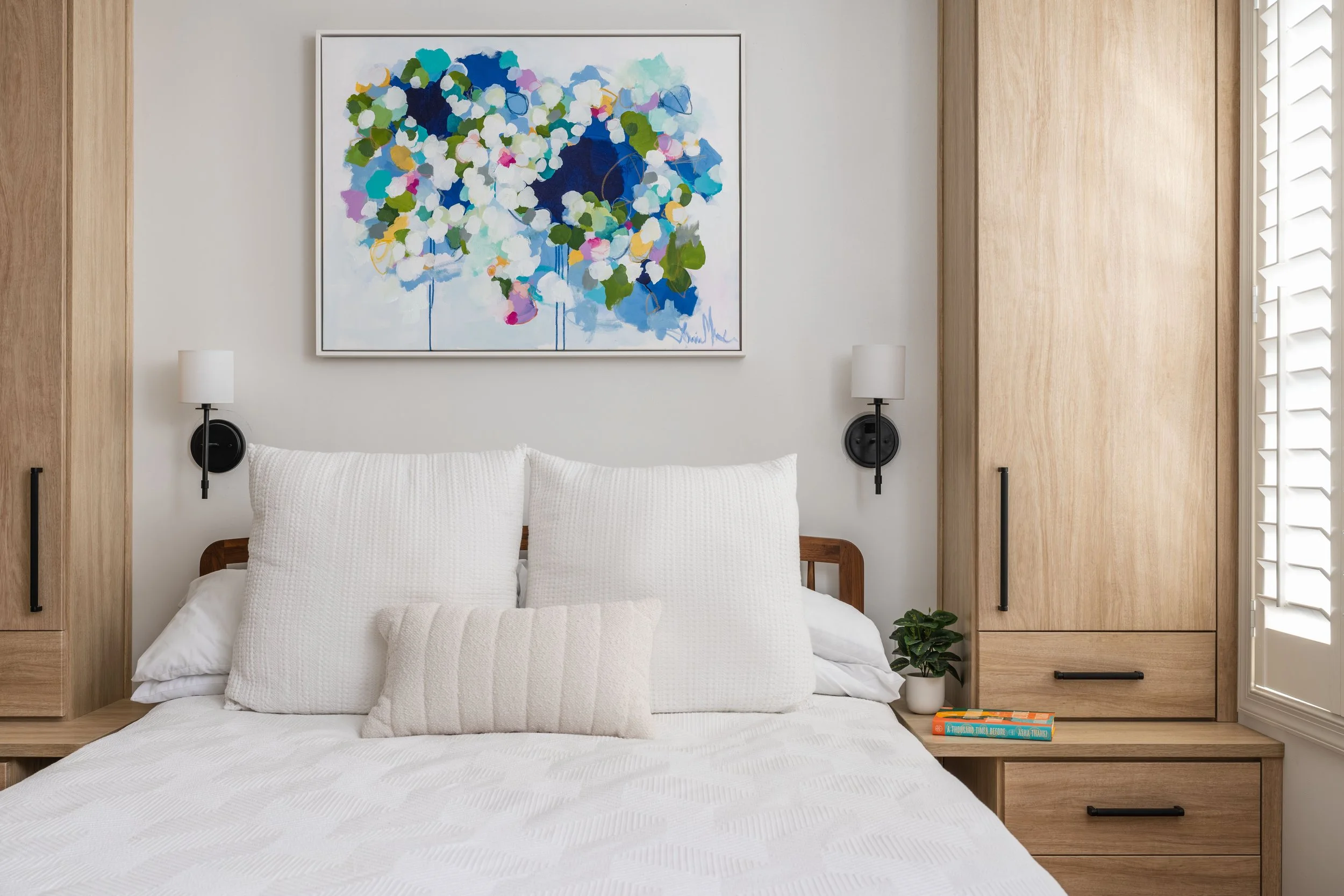 Master bedroom renovation in a DC rowhouse with warm wood built-in storage defining the space - Selis Studio Architecture.
