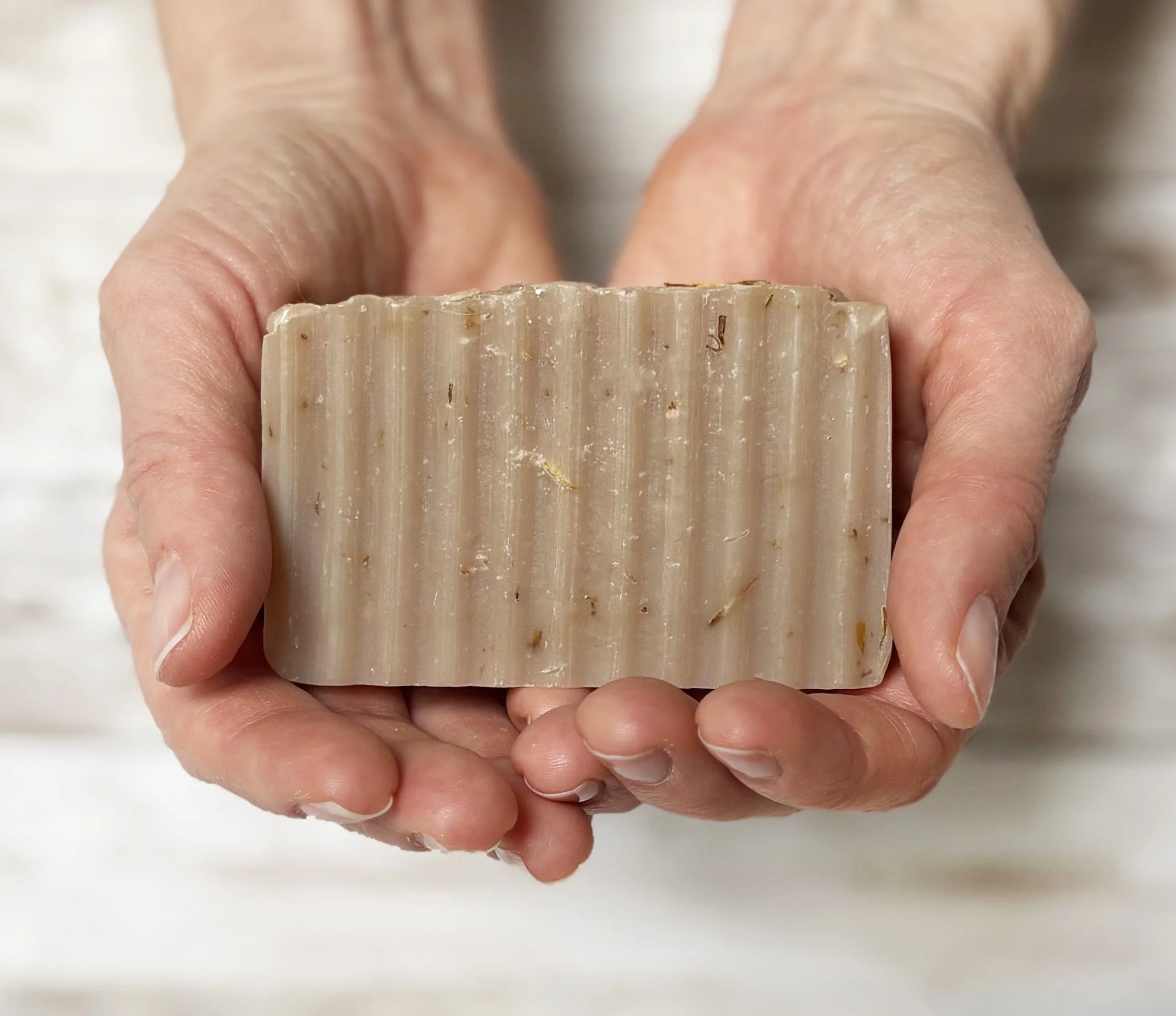 Colendula colada soap in hands.jpg