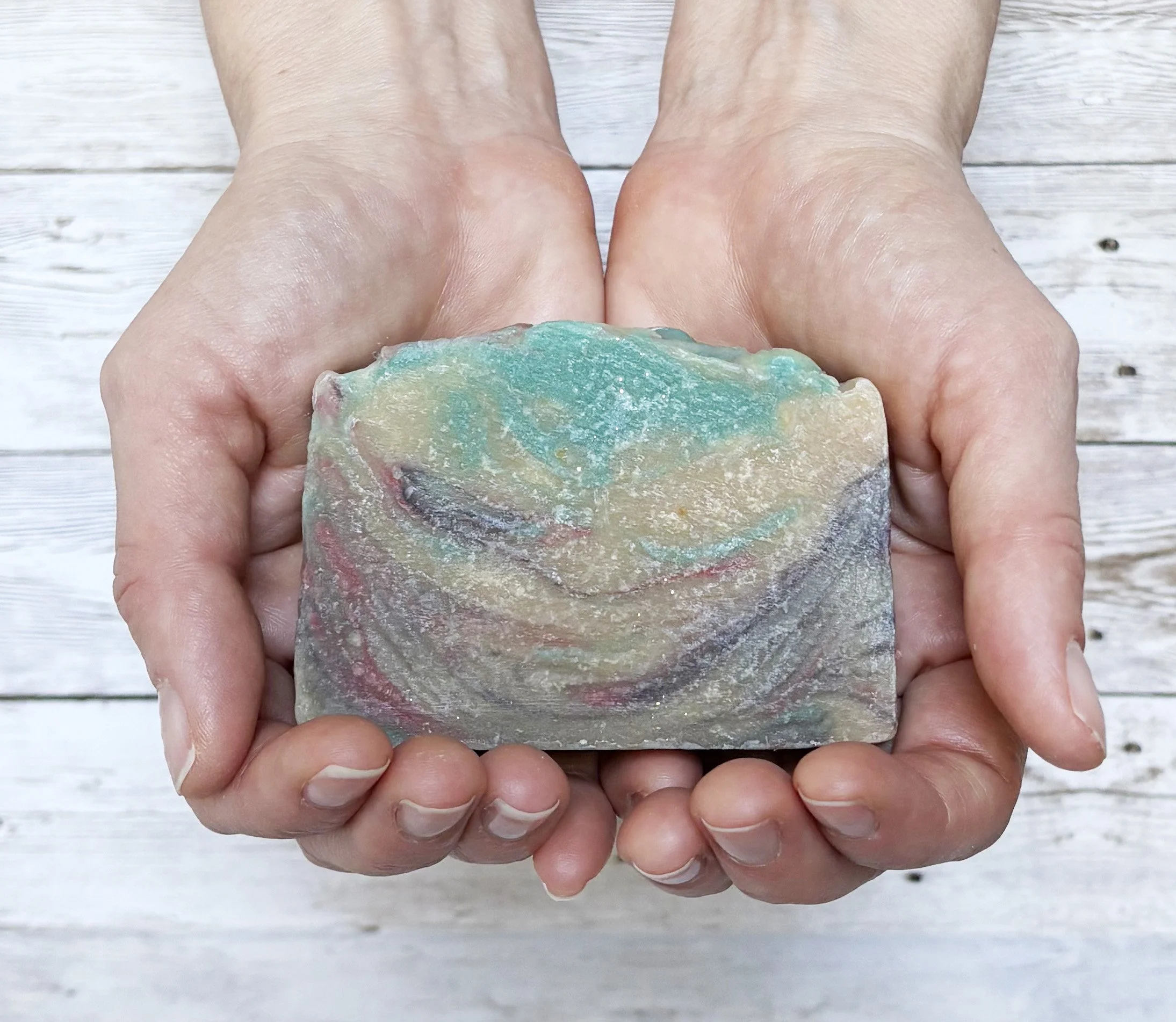 Mountain cedarwood soap in hands.jpg
